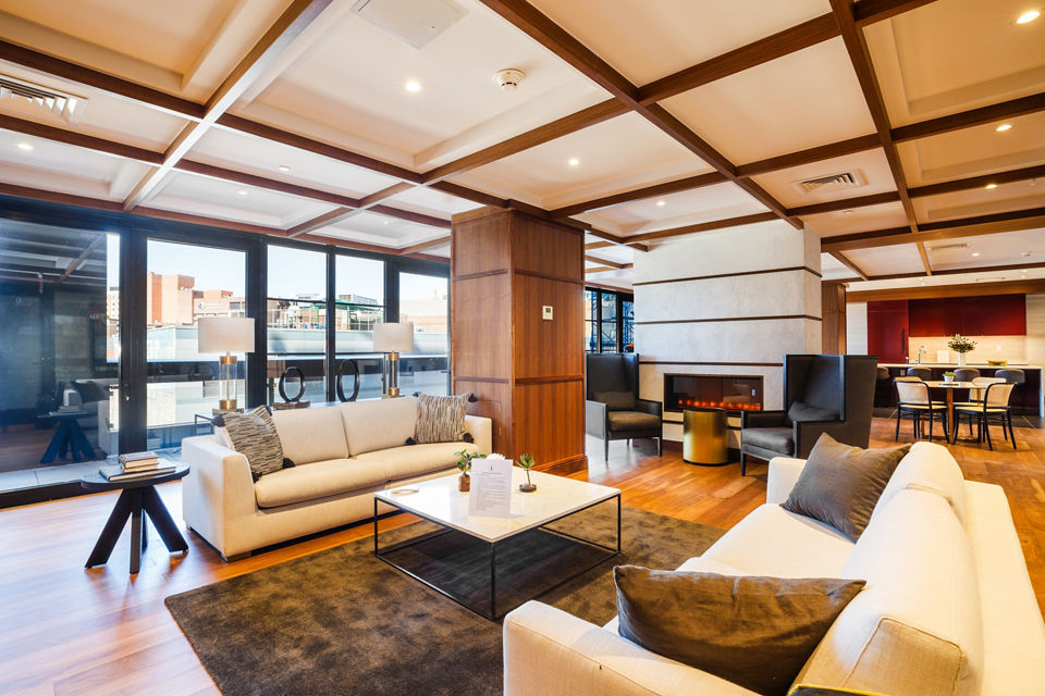 Clubhouse with modern decor and ample seating at 1 Flatbush Apartments, a luxury property by Greystar in Brooklyn