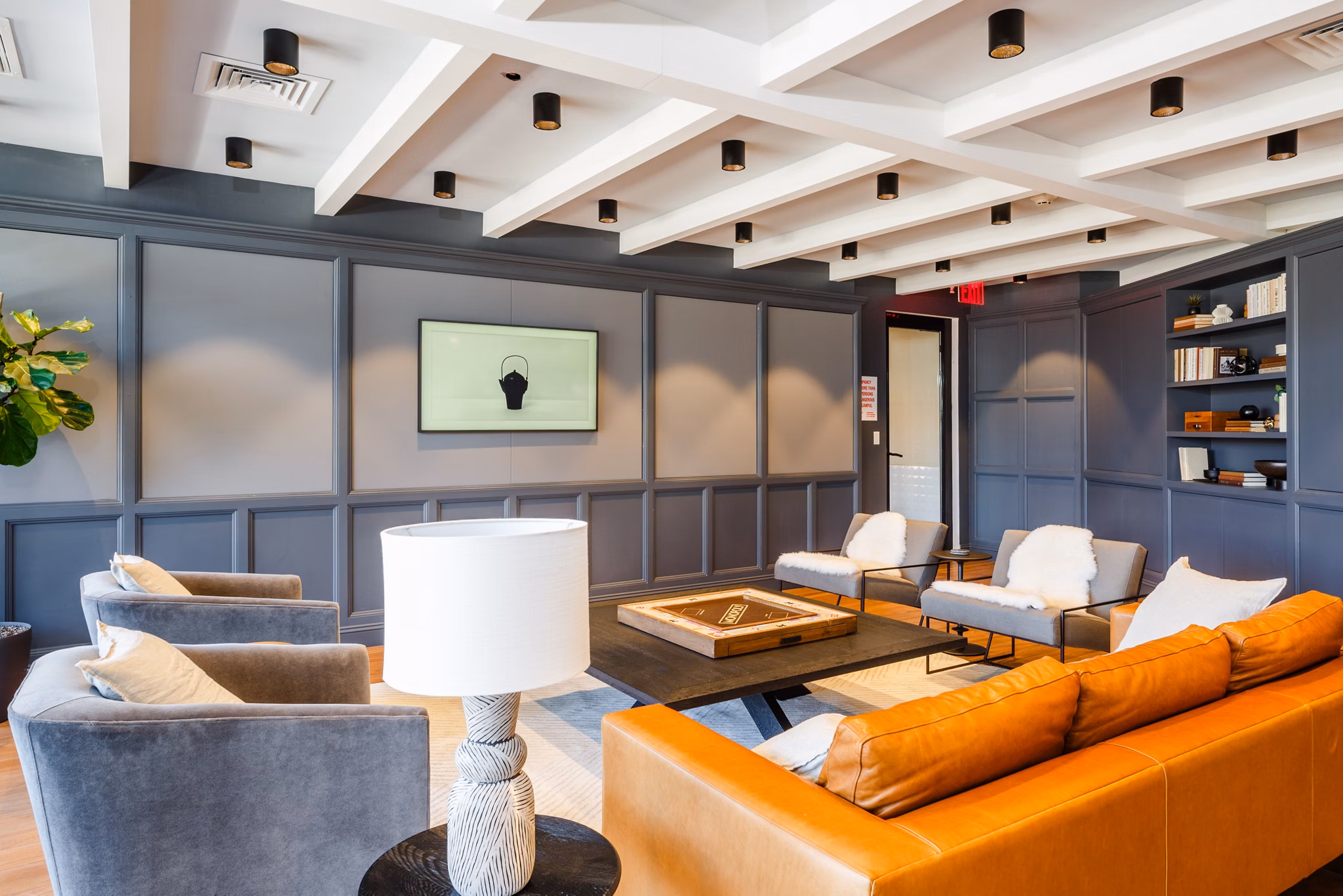 Clubhouse featuring modern design and lounge seating at 1 Flatbush Apartments