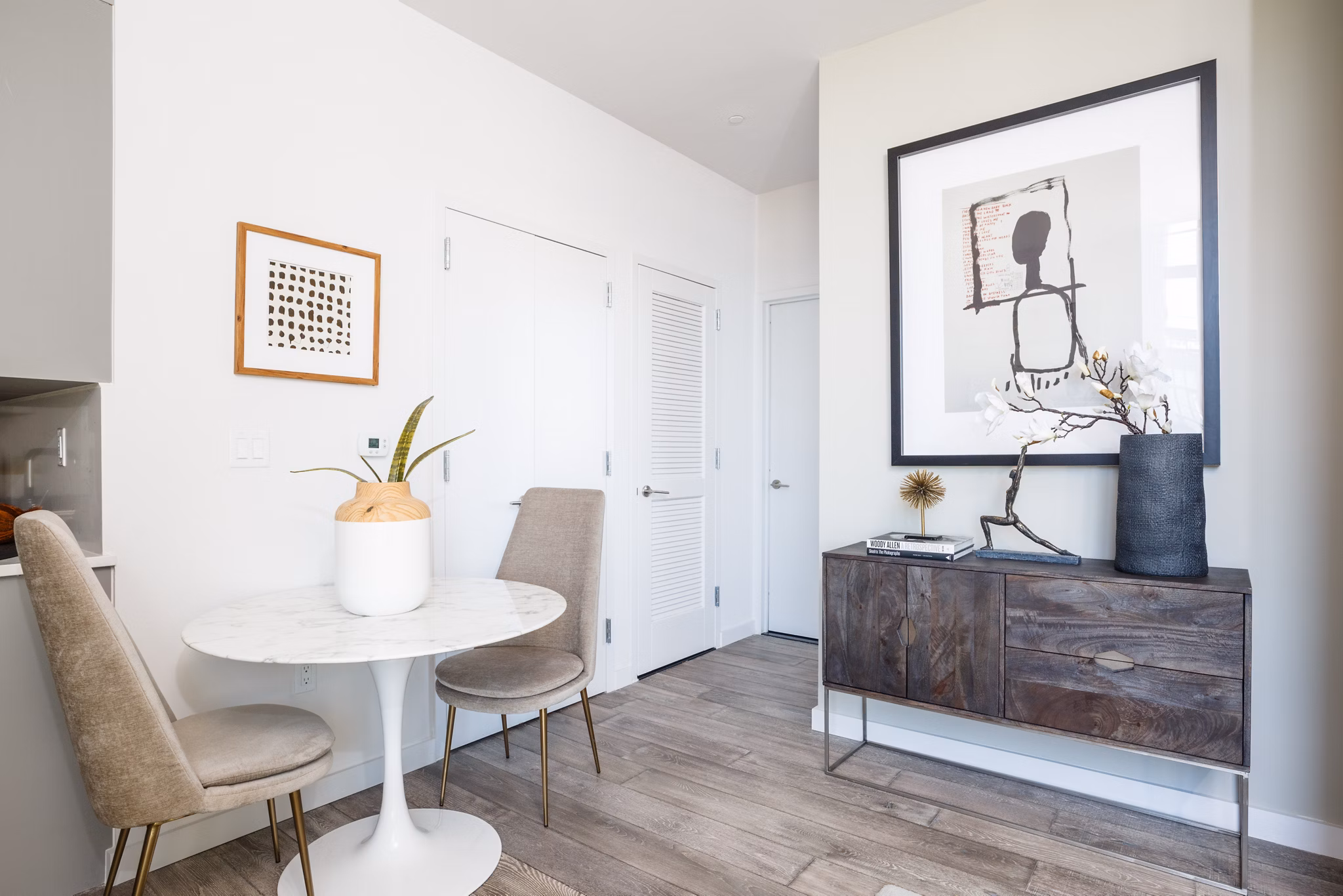 Dining area with modern furnishings and elegant lighting in 1 Flatbush Apartments