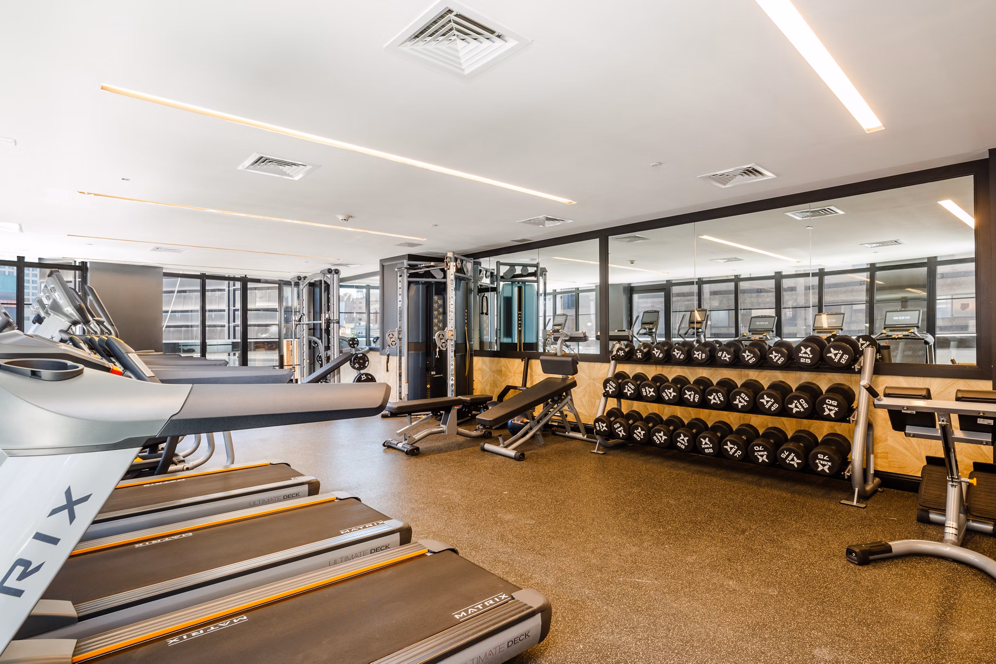 Well-equipped fitness center at 1 Flatbush Apartments with modern exercise machines, designed for residents' health and wellness goals