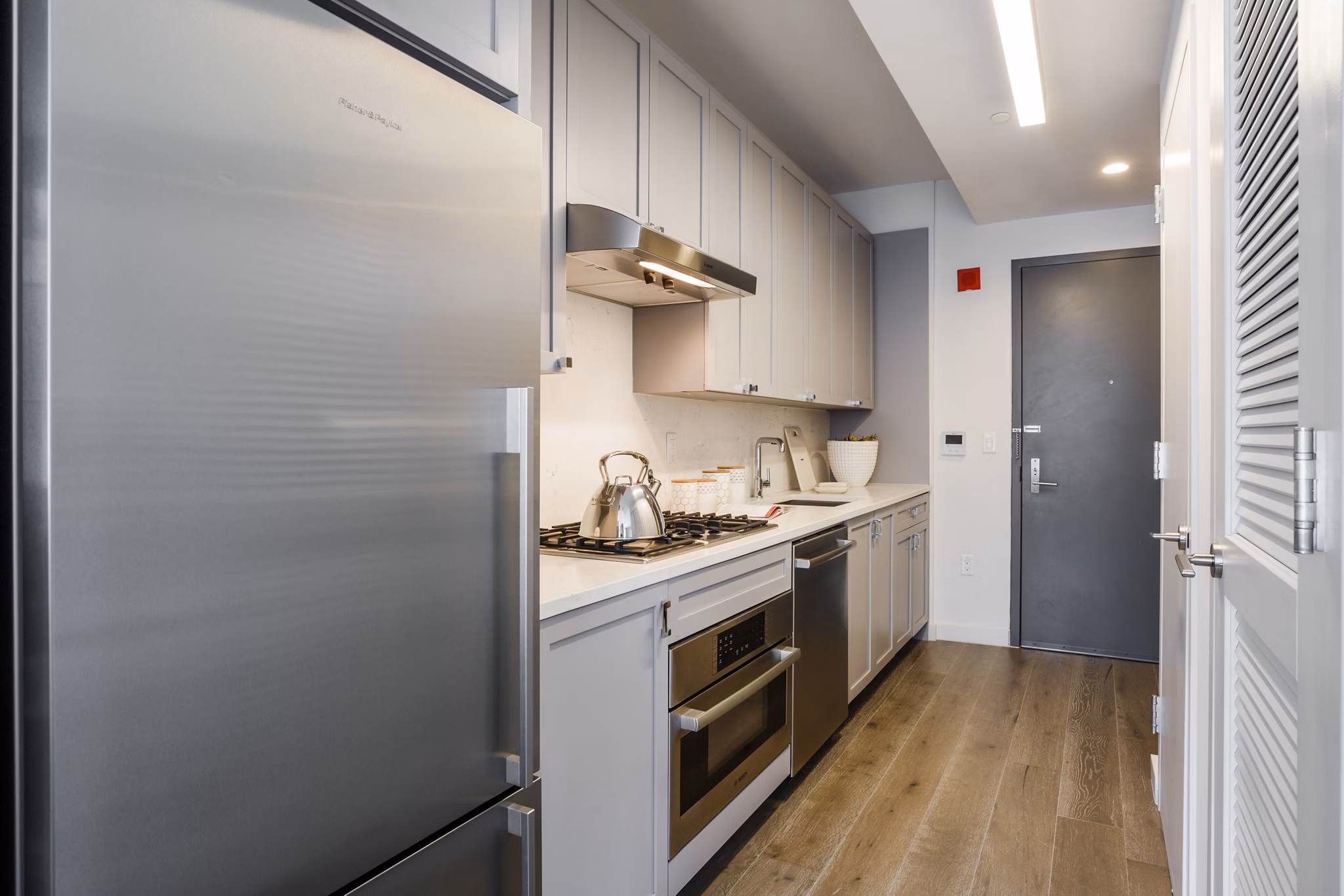 Modern kitchen with sleek appliances at 1 Flatbush Apartments, luxury living in the heart of downtown Brooklyn