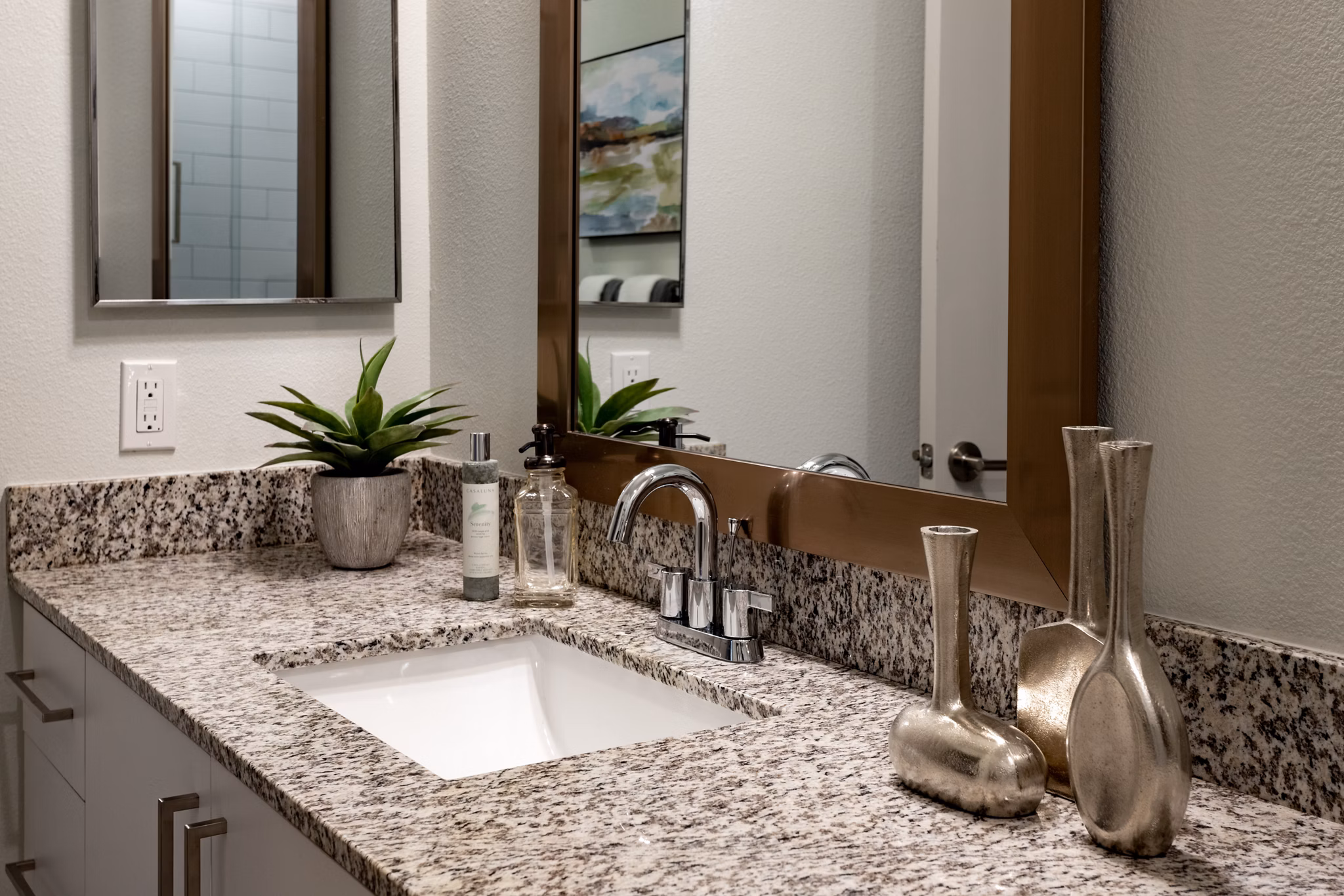 Modern bathroom featuring elegant fixtures and spacious layout at Overture Hamlin Apartments