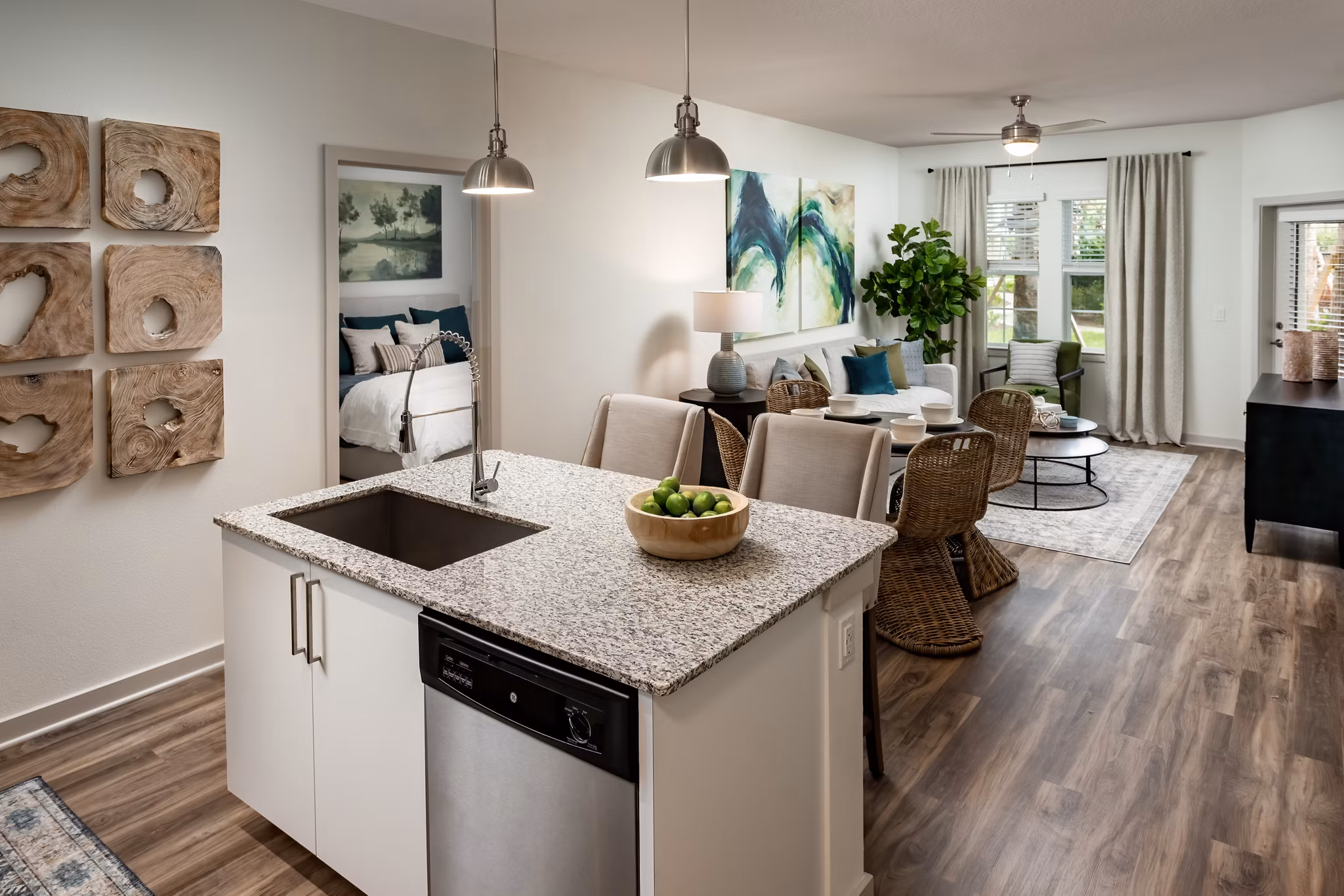 Modern kitchen with stainless steel appliances and granite countertops at Overture Hamlin Apartments luxury living