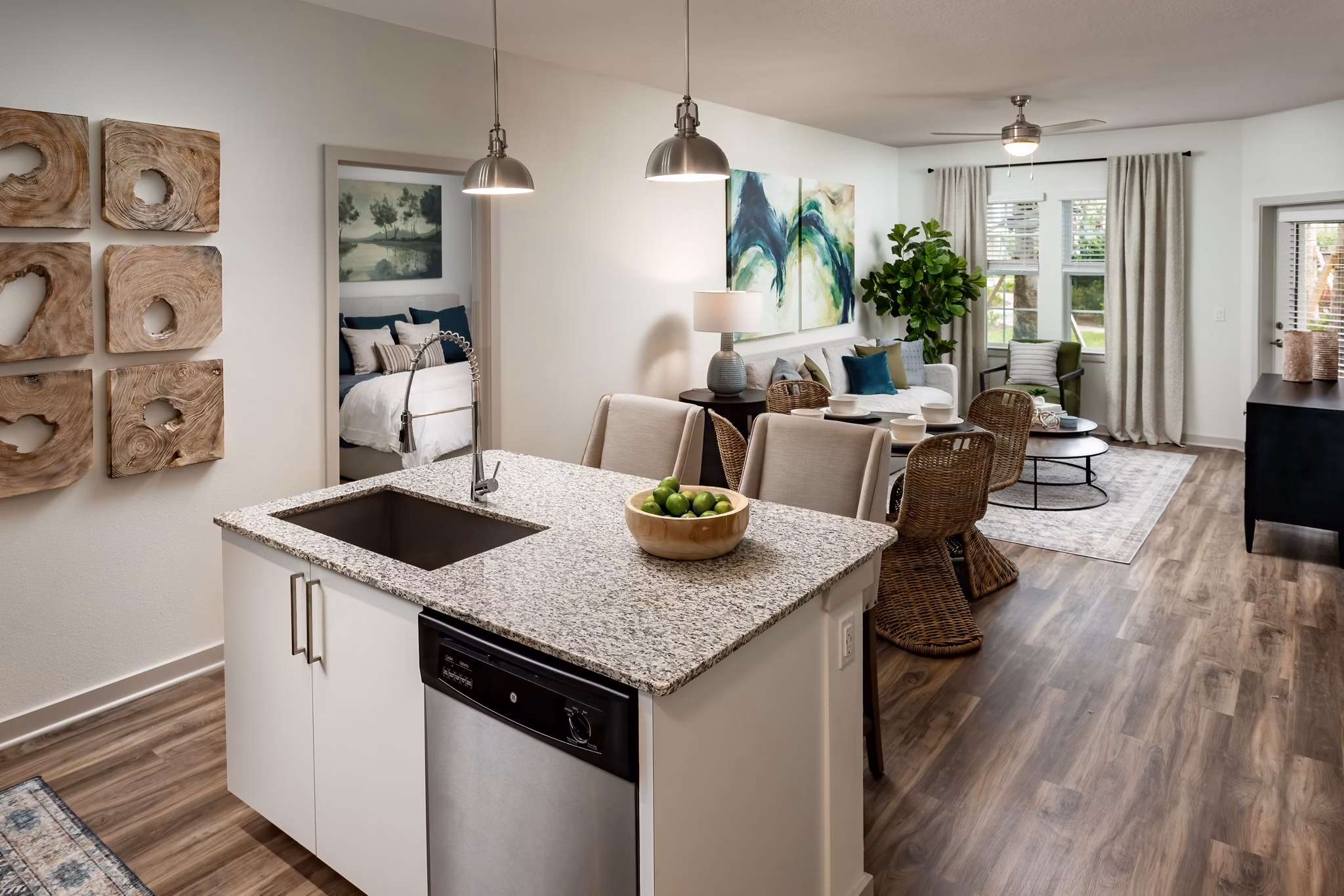 Modern kitchen with stainless steel appliances and granite countertops at Overture Hamlin Apartments luxury living