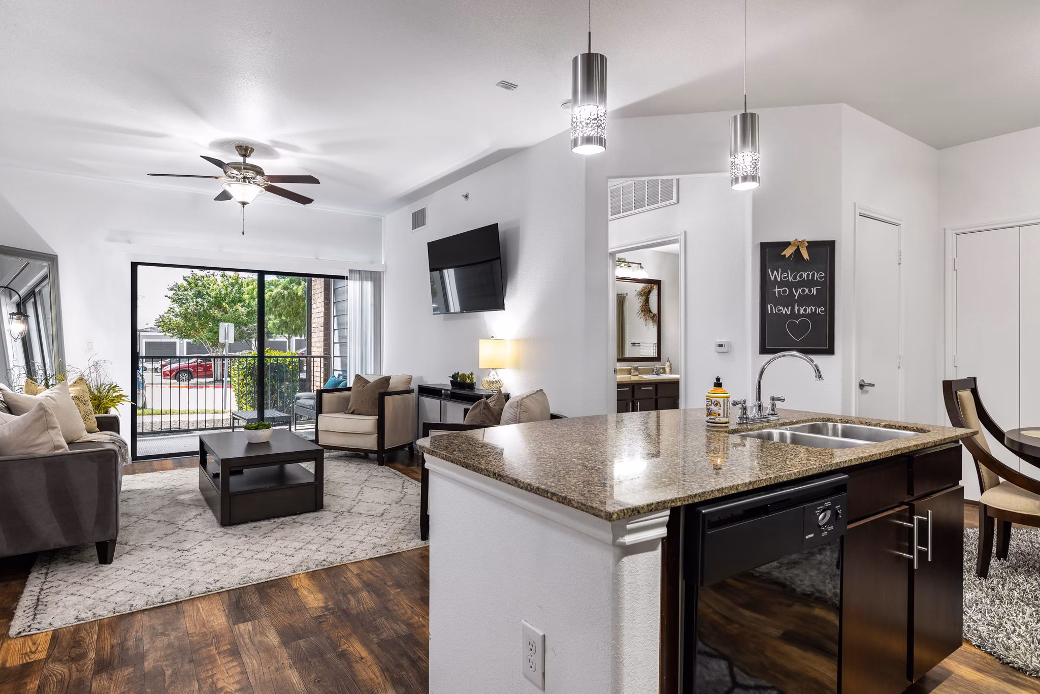 Modern kitchen with stainless steel appliances in The Oaks at Techridge Apartments, luxury living in Austin