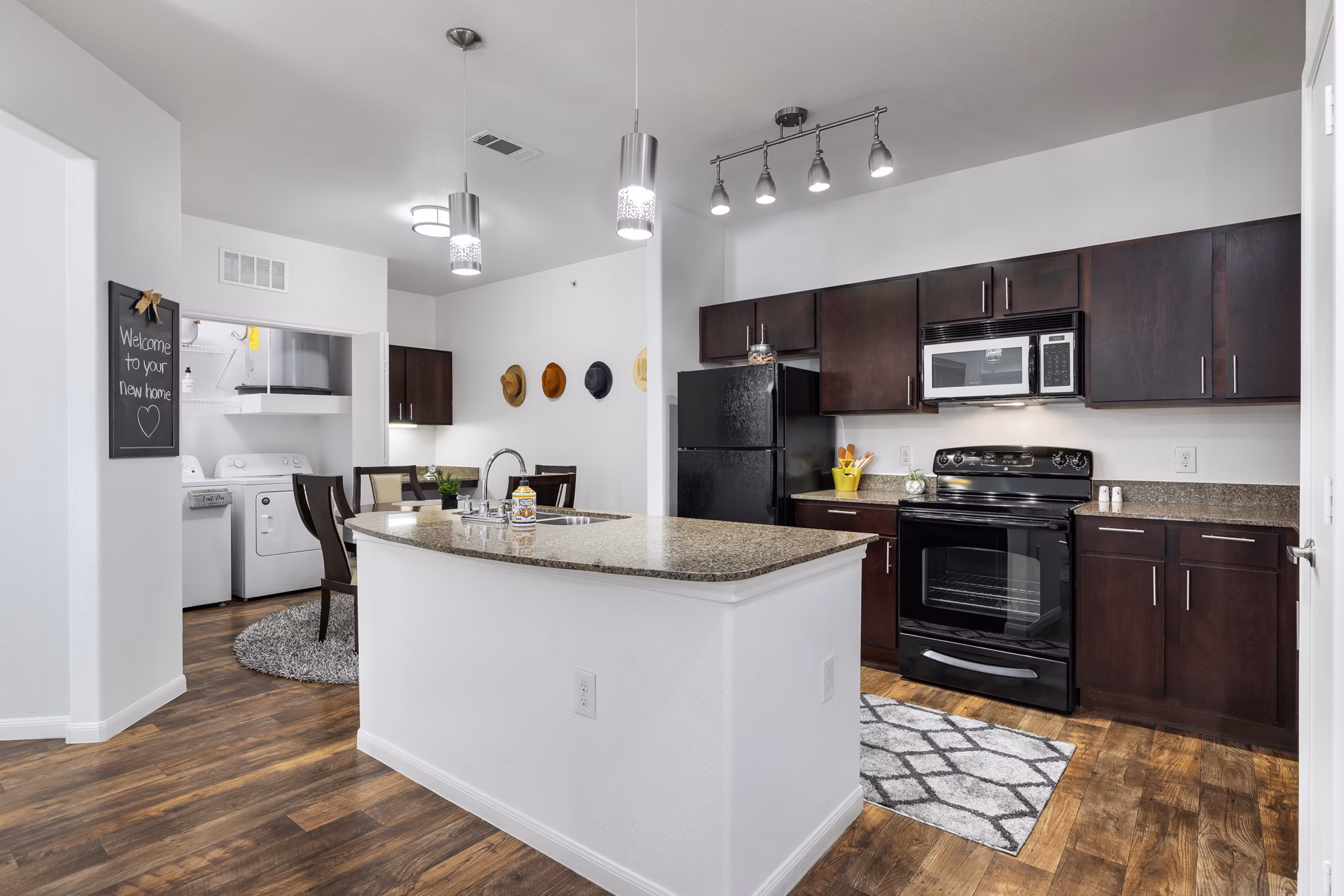 Modern kitchen with stainless steel appliances at The Oaks at Techridge Apartments
