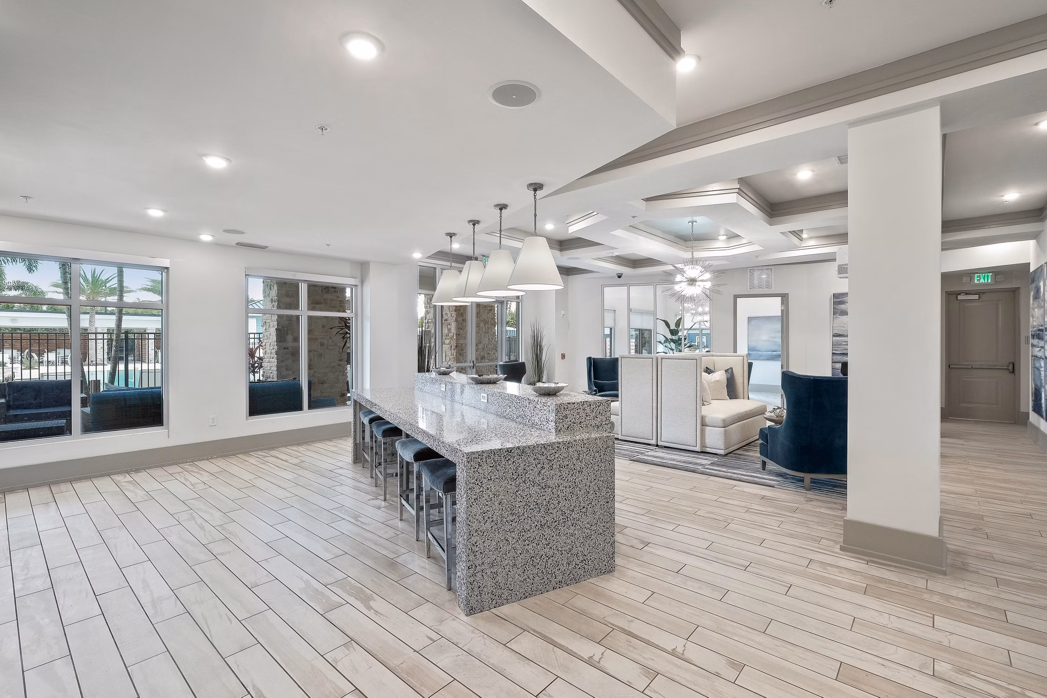 Elegant clubhouse with modern decor at Vue at Belleair Apartments, featuring social spaces and entertainment amenities