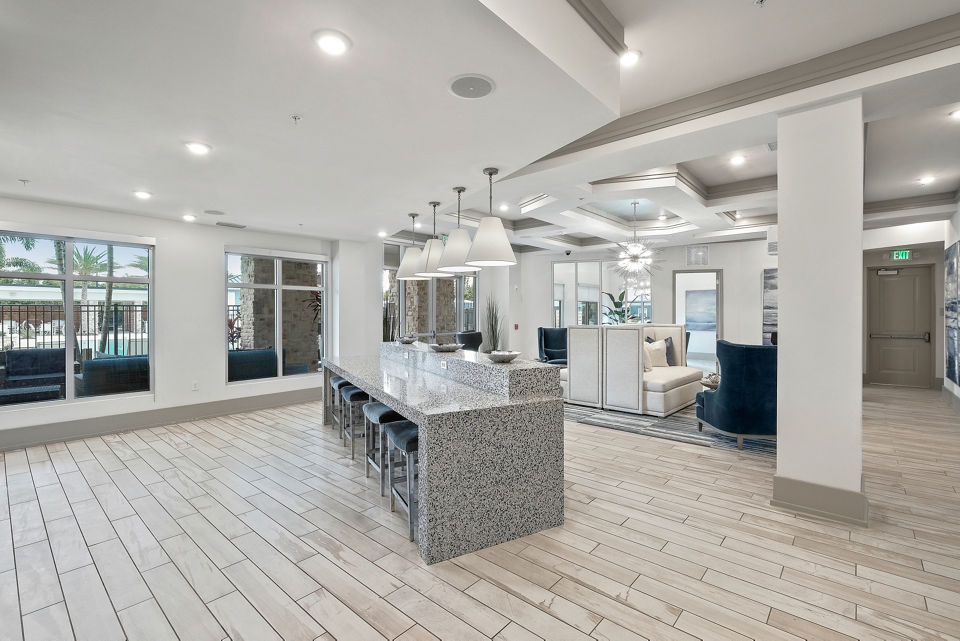 Elegant clubhouse with modern decor at Vue at Belleair Apartments, featuring social spaces and entertainment amenities