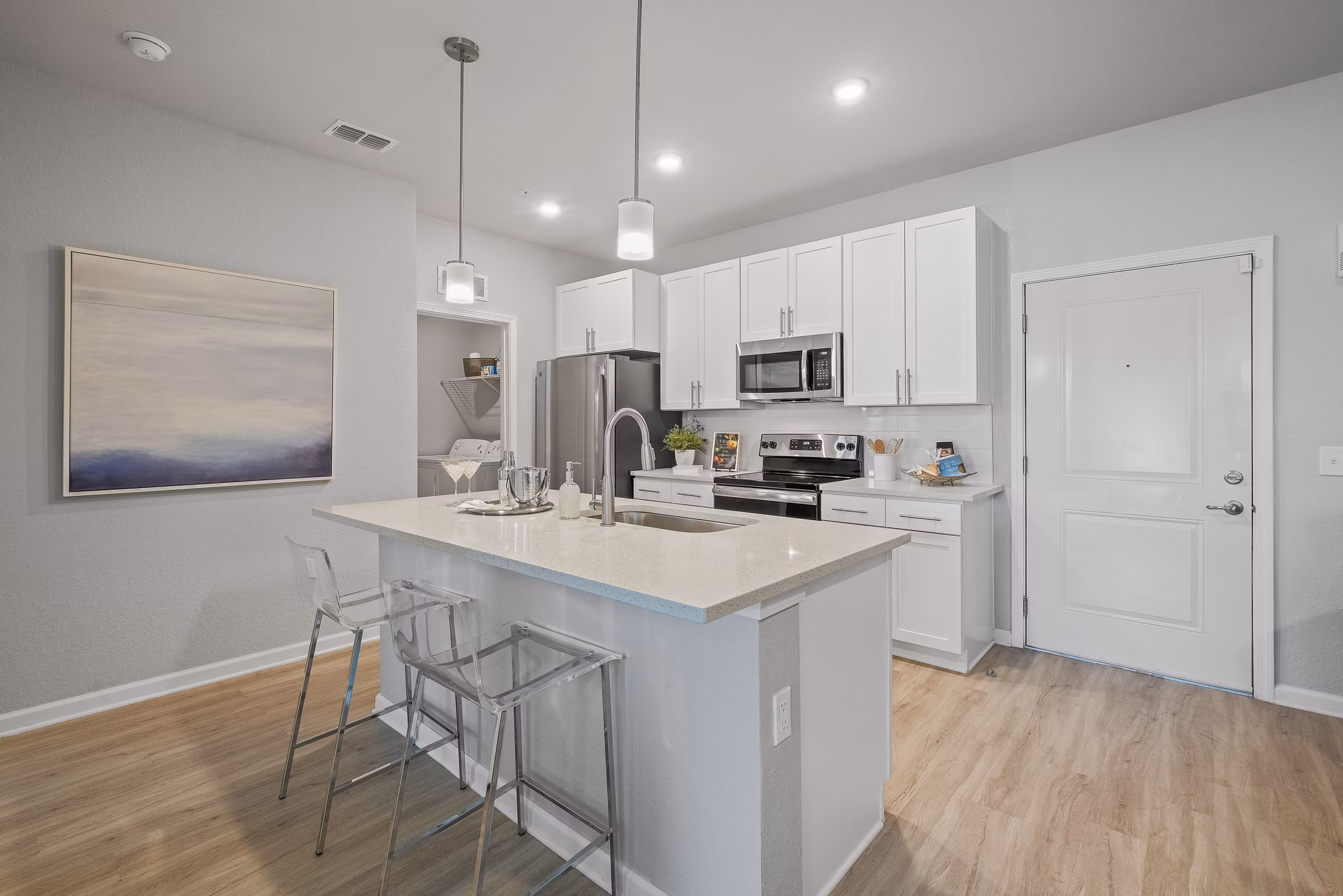 Modern kitchen with stainless steel appliances at Vue at Belleair Apartments