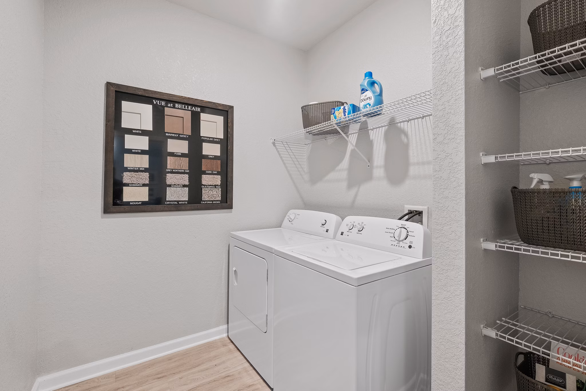Modern laundry room with high-efficiency washers and dryers at Vue at Belleair Apartments