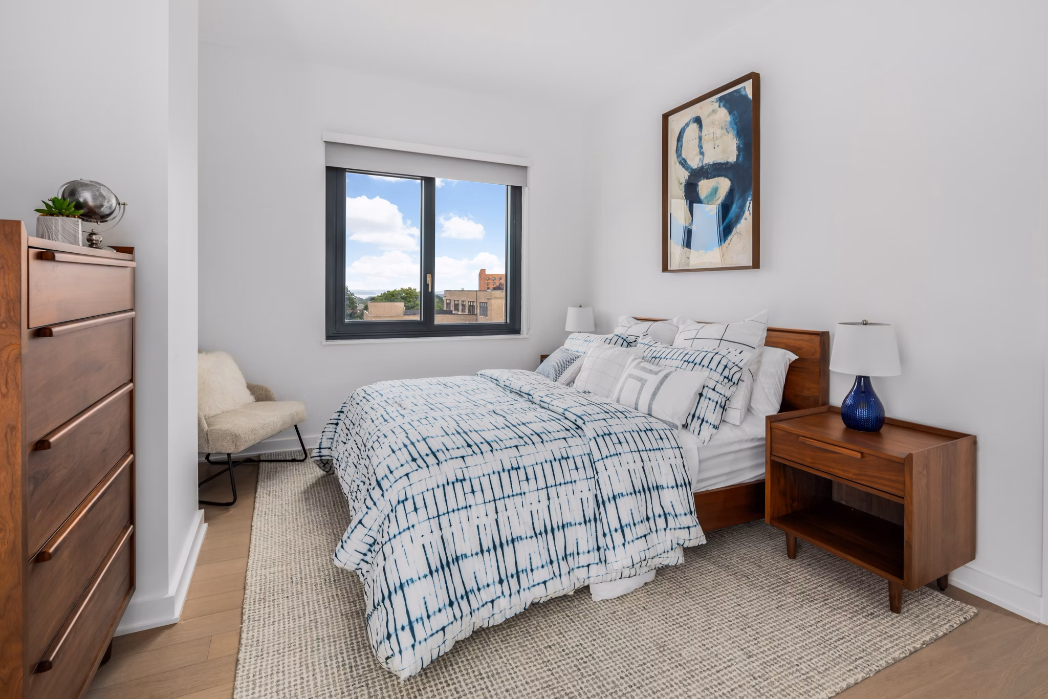 Spacious bedroom with modern furnishings at 360 Huguenot Apartments in New Rochelle