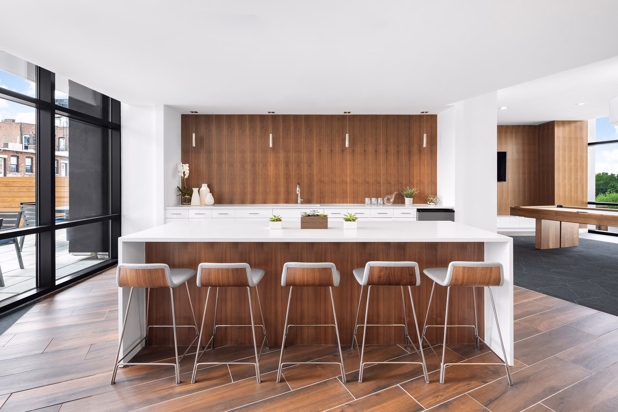 Clubhouse with modern decor and communal seating at 360 Huguenot Apartments