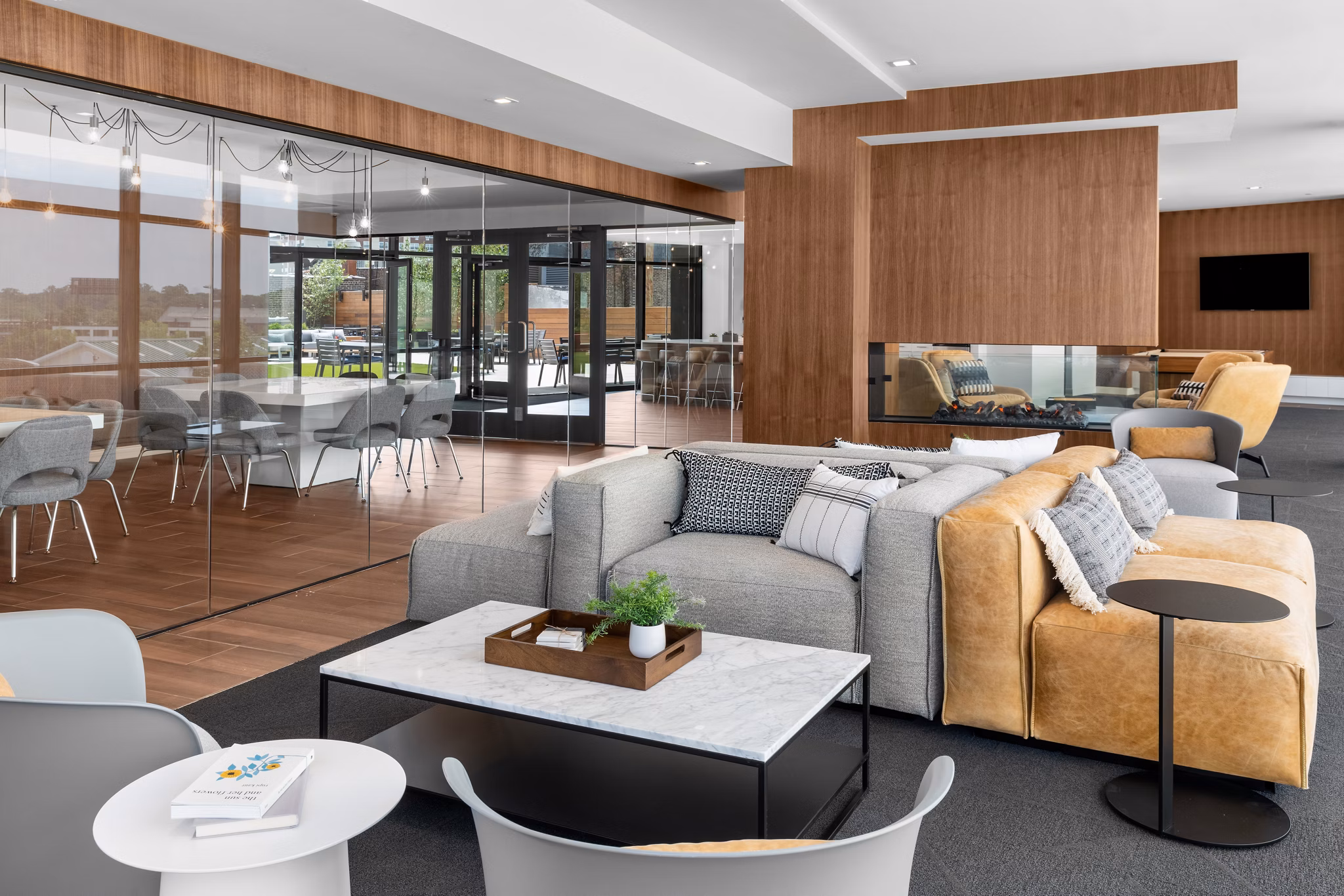 Luxury clubhouse featuring modern design and seating at 360 Huguenot Apartments