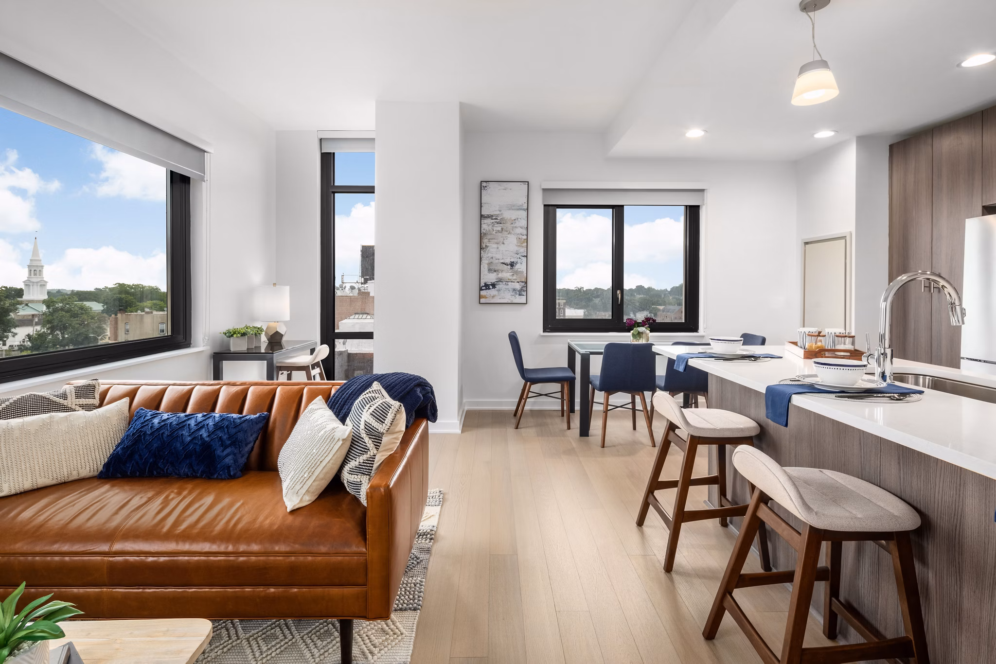 Modern kitchen with stainless steel appliances in 360 Huguenot Apartments