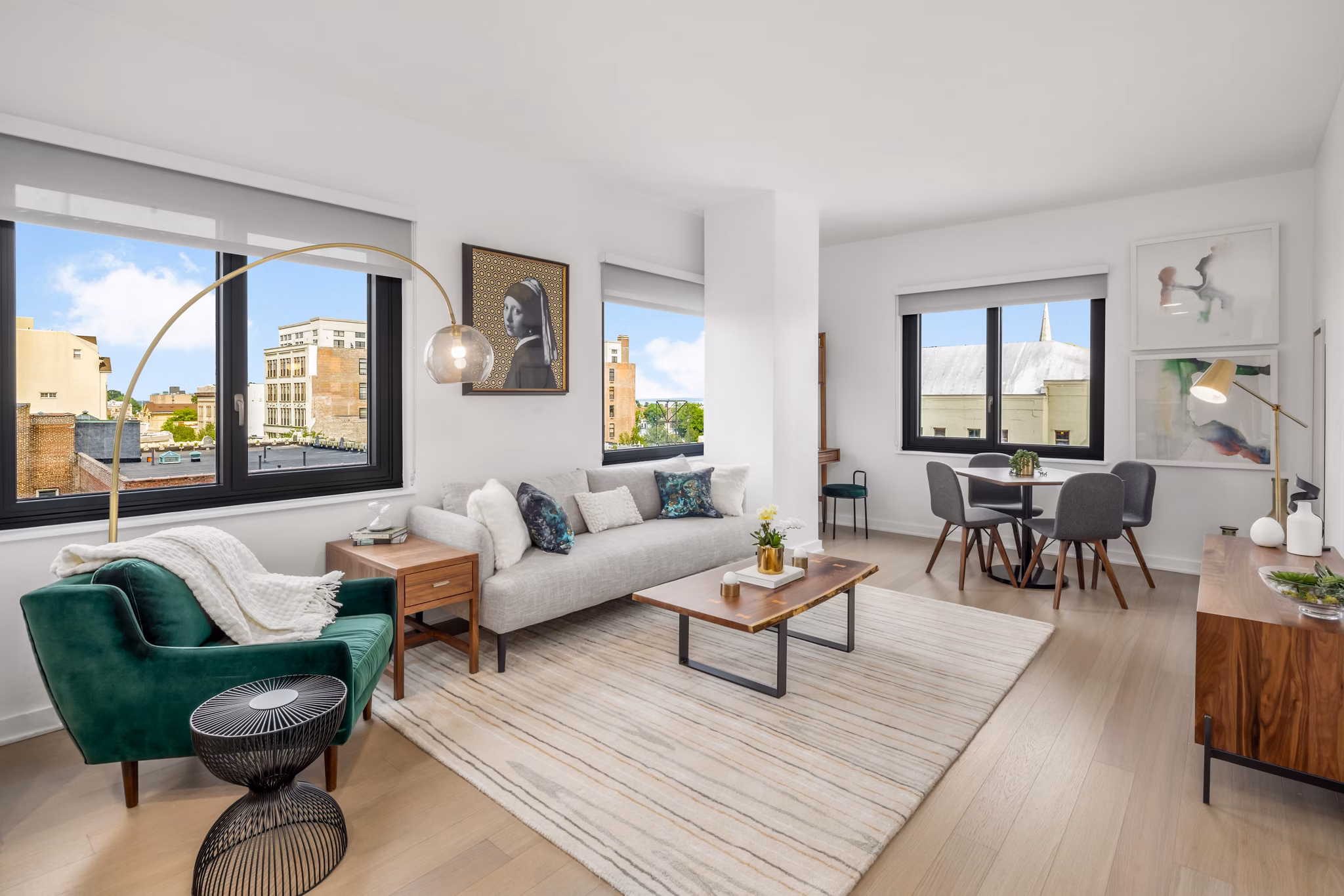 Spacious living room with modern decor and large windows in 360 Huguenot Apartments
