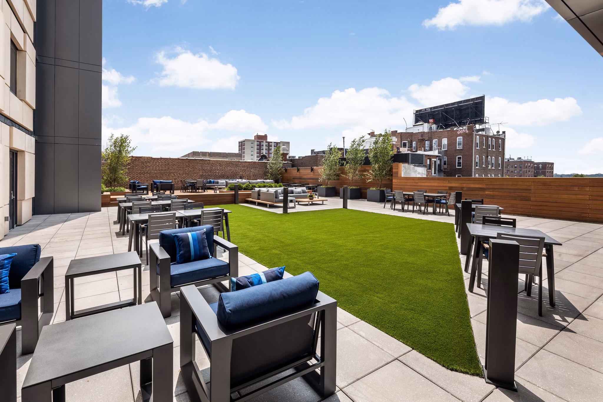 Courtyard with lush landscaping at 360 Huguenot Apartments in downtown New Rochelle, offering luxury living with serene outdoor spaces
