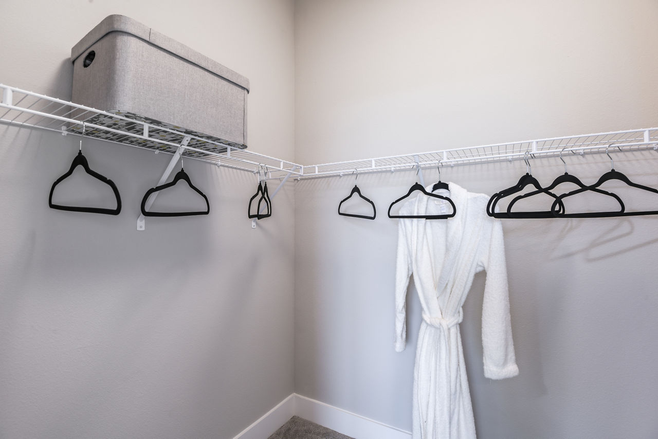 Walk-in closet with ample storage at The Lodge at Hamlin Apartments