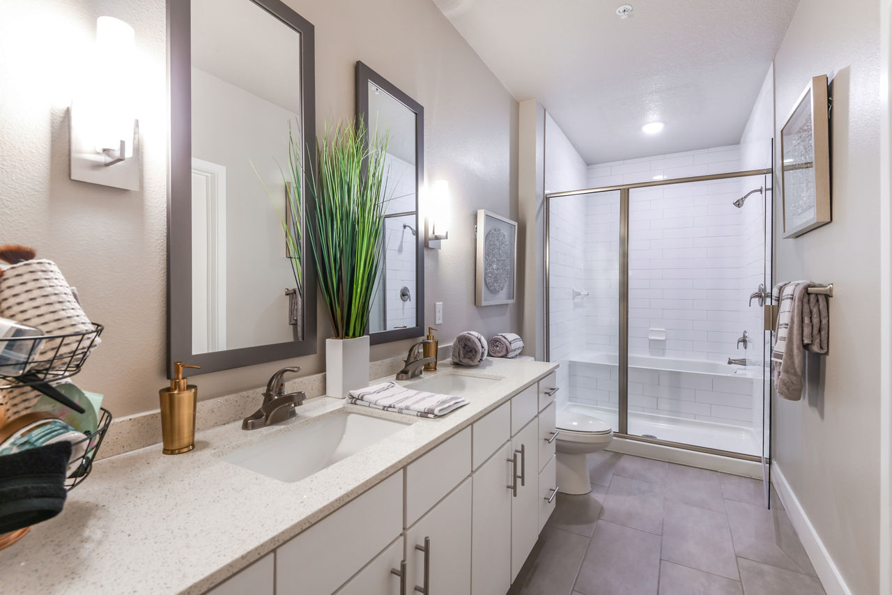 Modern bathroom with sleek fixtures at The Lodge at Hamlin Apartments