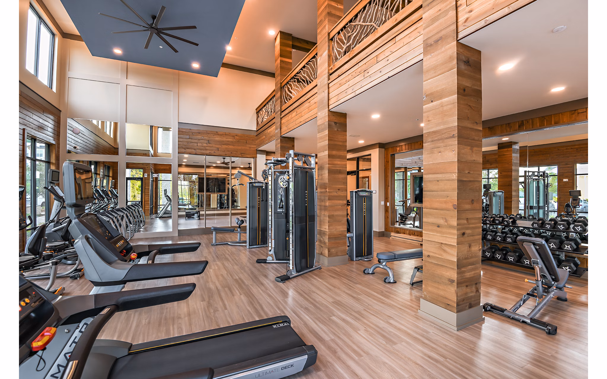Fitness center with modern equipment at The Lodge at Hamlin Apartments