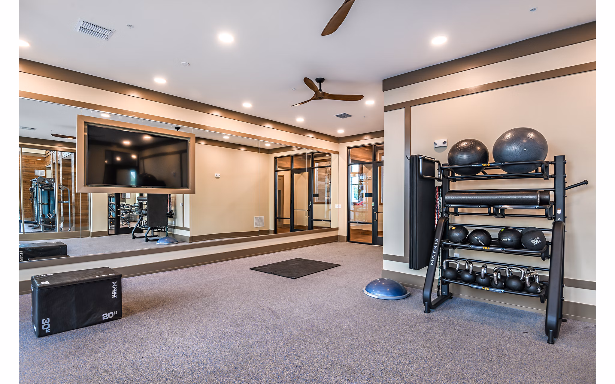Modern fitness center with state-of-the-art equipment at The Lodge at Hamlin Apartments