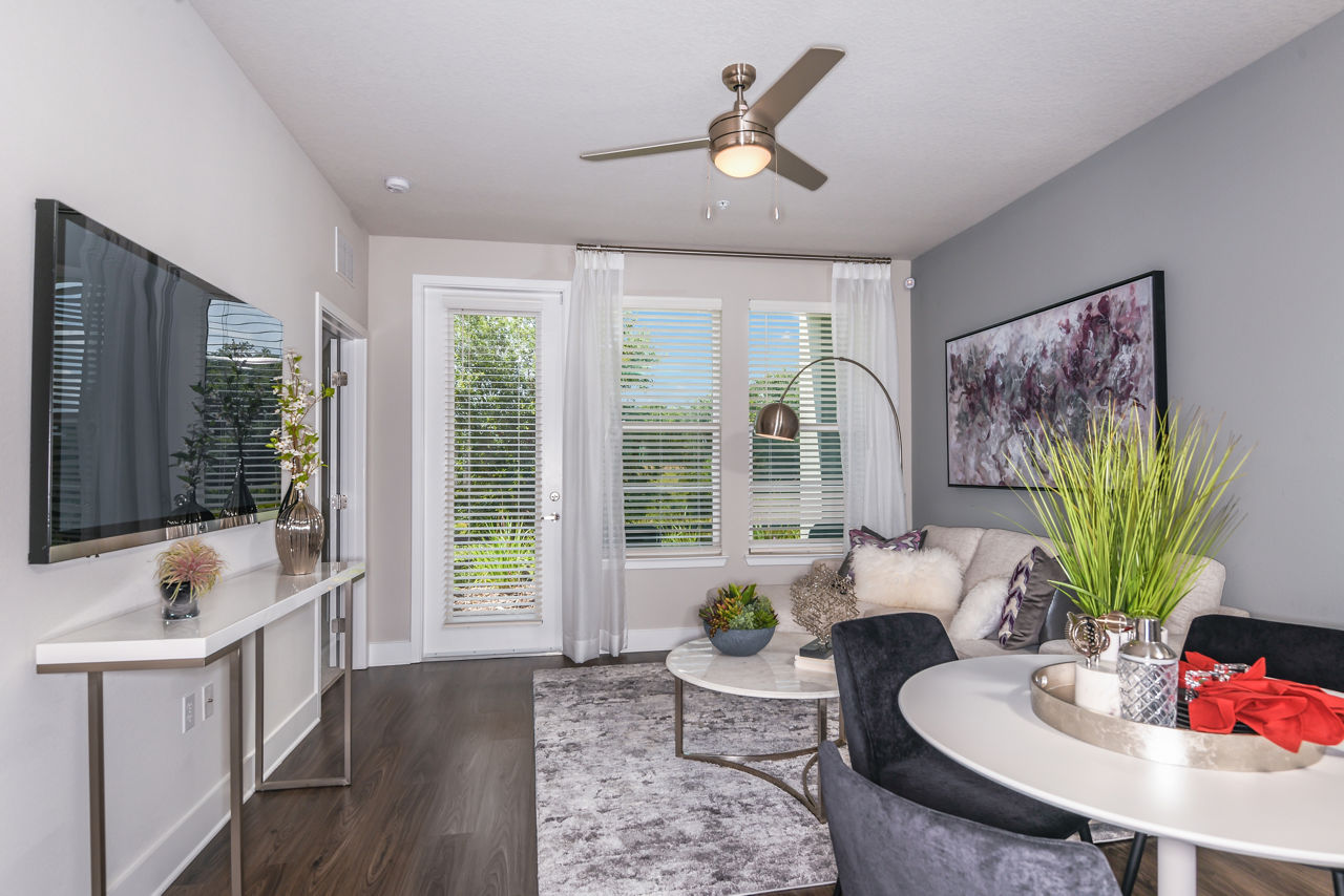 Spacious living room with modern decor at The Lodge at Hamlin Apartments