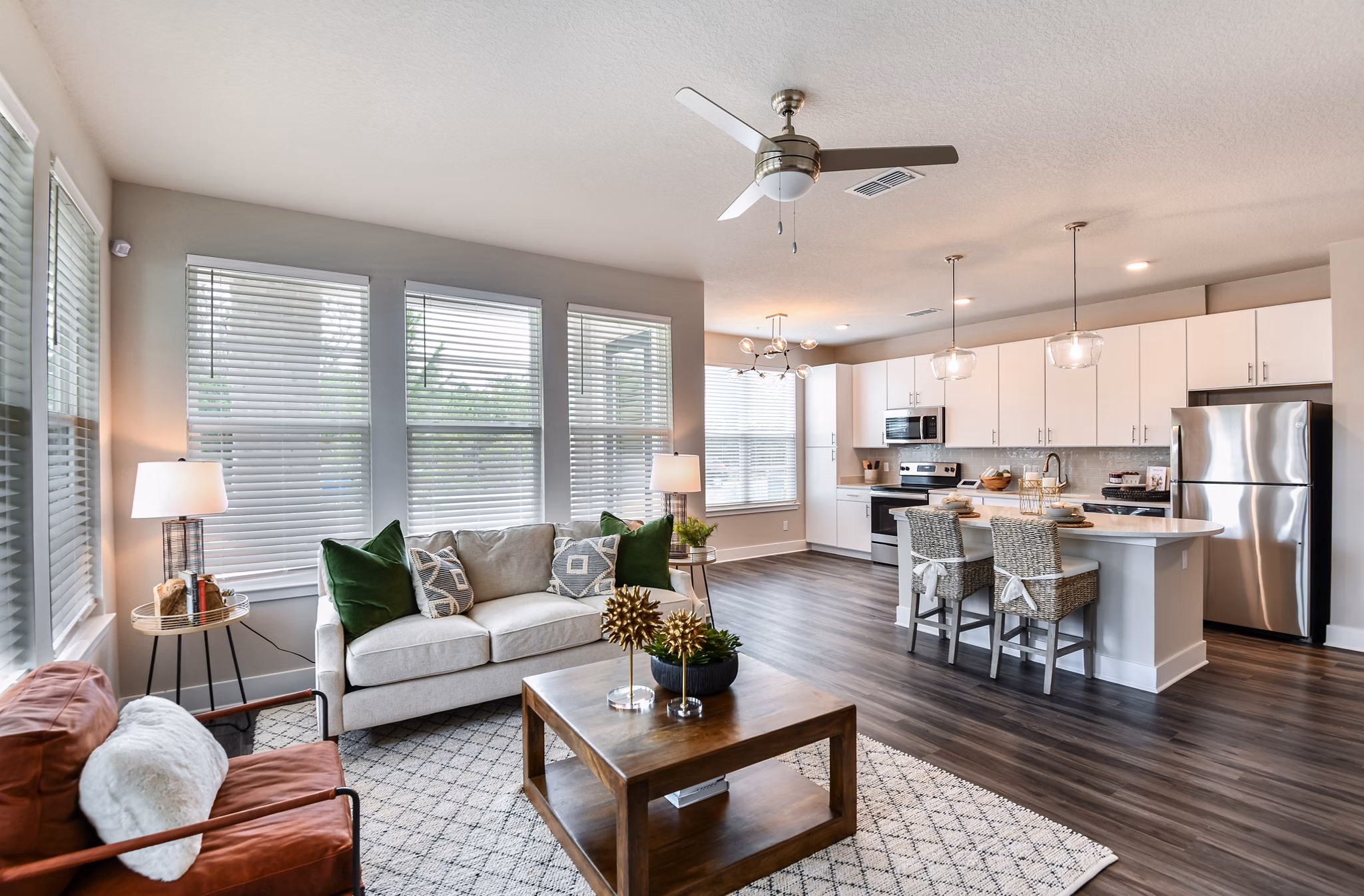 Modern living room with cozy seating and elegant decor at The Lodge at Hamlin Apartments