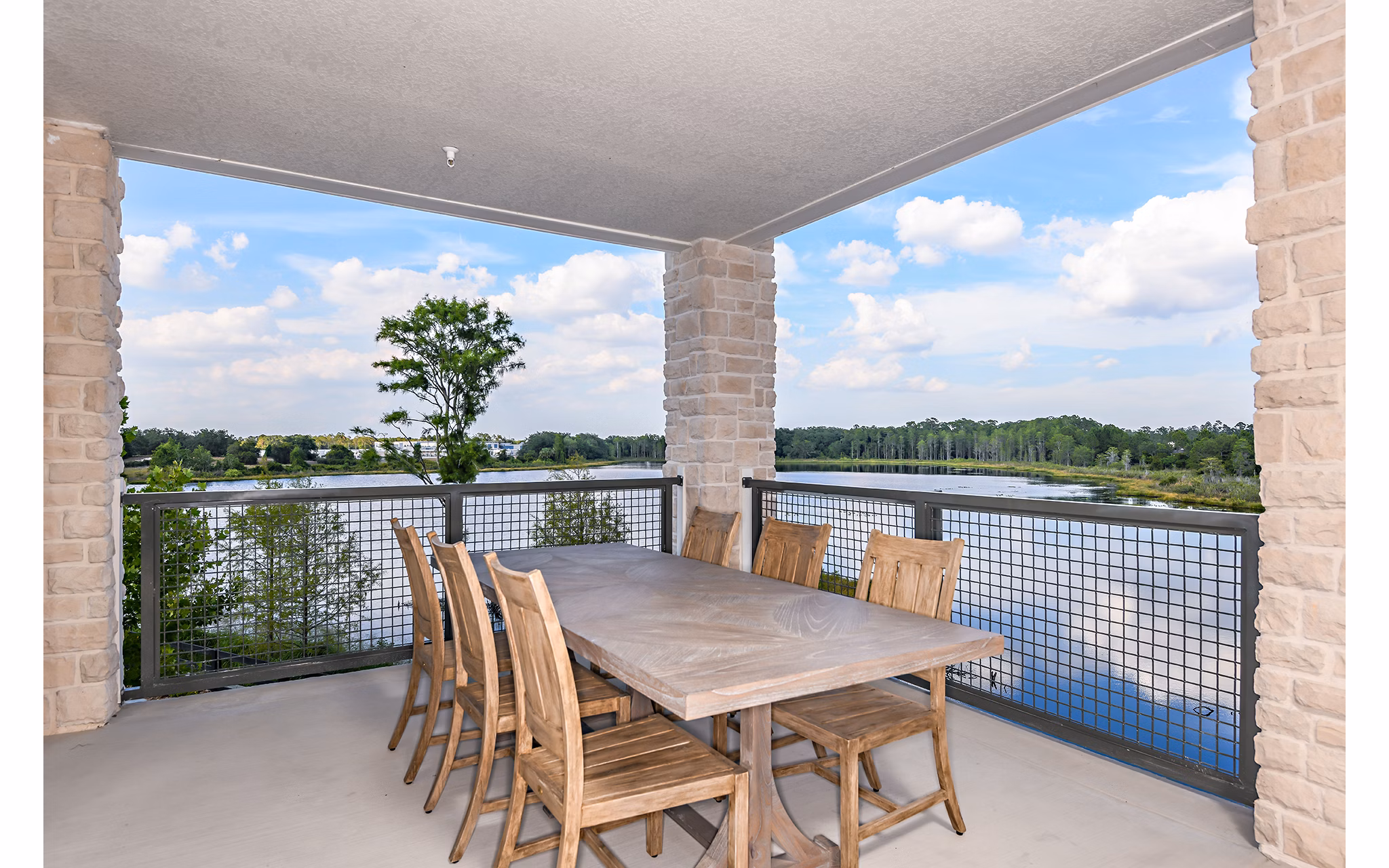 The Lodge at Hamlin: Cozy patio with outdoor seating in luxury apartments