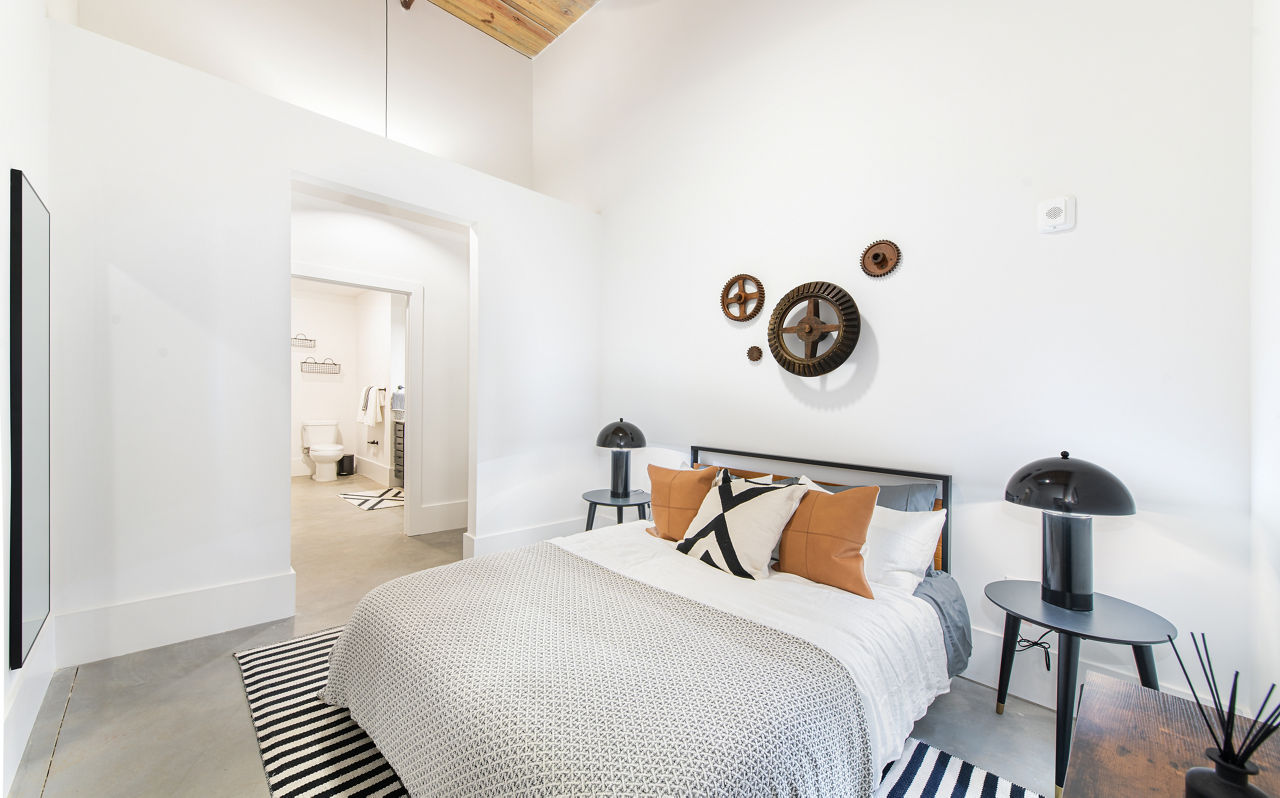 Cozy bedroom with natural light at The Lofts at Woodside Mill Apartments