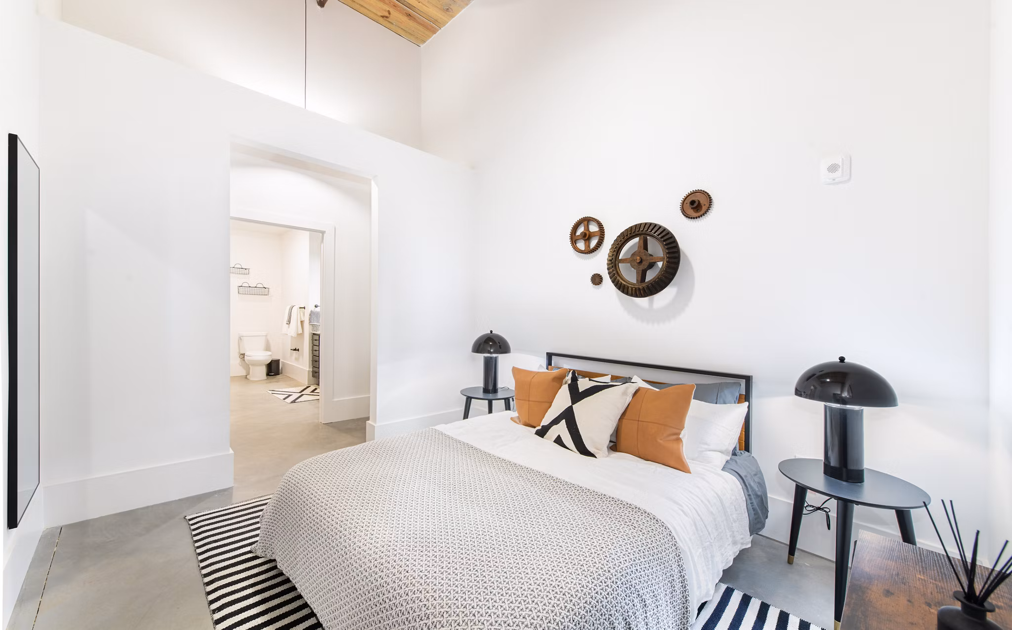 Cozy bedroom with natural light at The Lofts at Woodside Mill Apartments