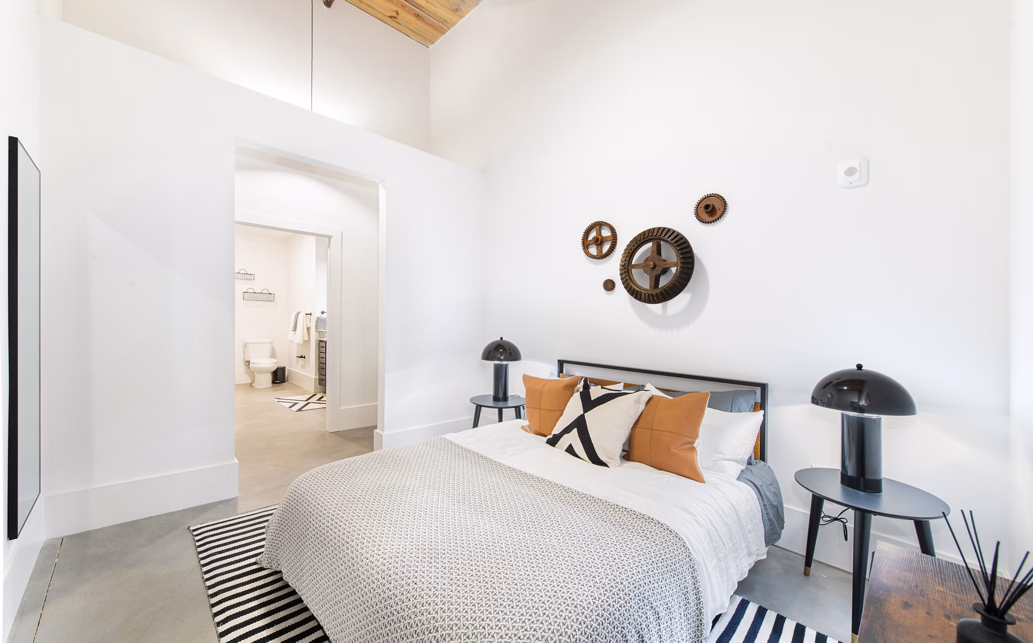 Cozy bedroom with natural light at The Lofts at Woodside Mill Apartments