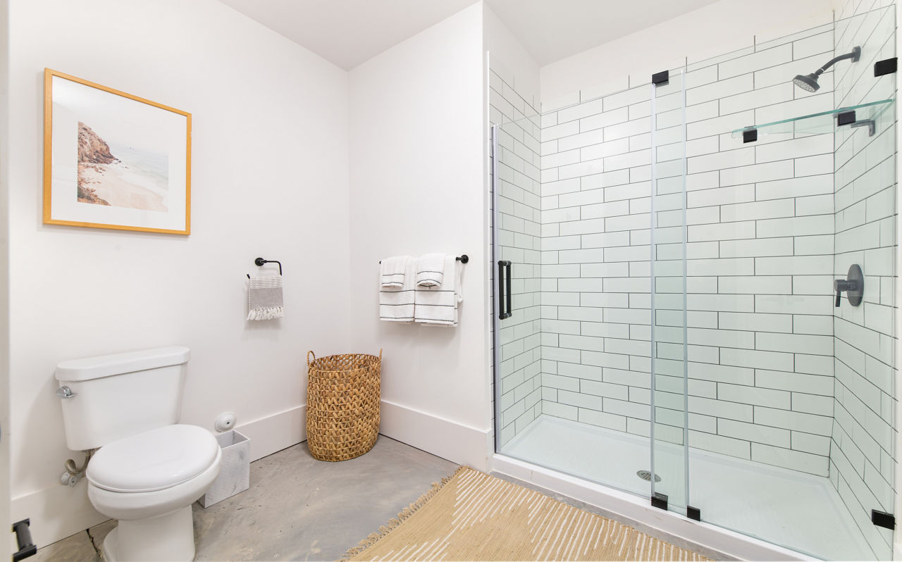 Spacious bathroom with modern fixtures at The Lofts at Woodside Mill Apartments