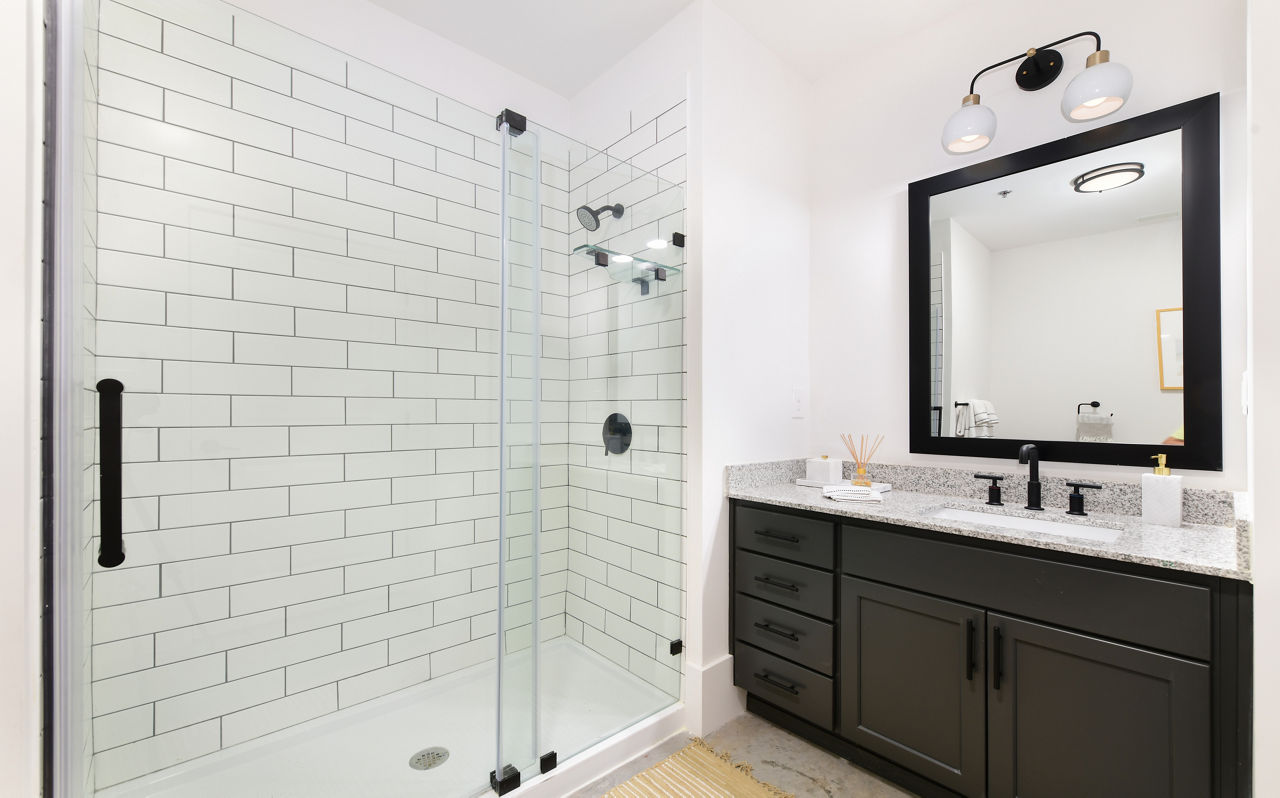 Modern bathroom with elegant fixtures in The Lofts at Woodside Mill Apartments