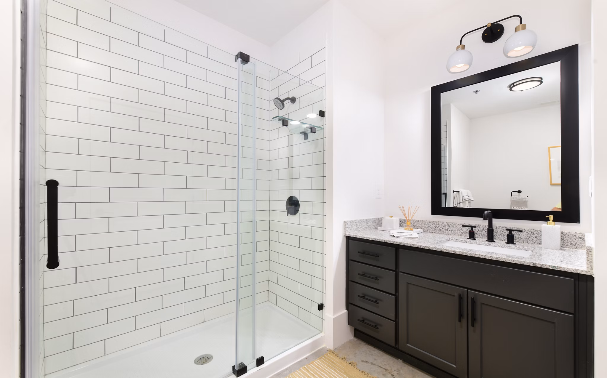 Modern bathroom with elegant fixtures in The Lofts at Woodside Mill Apartments