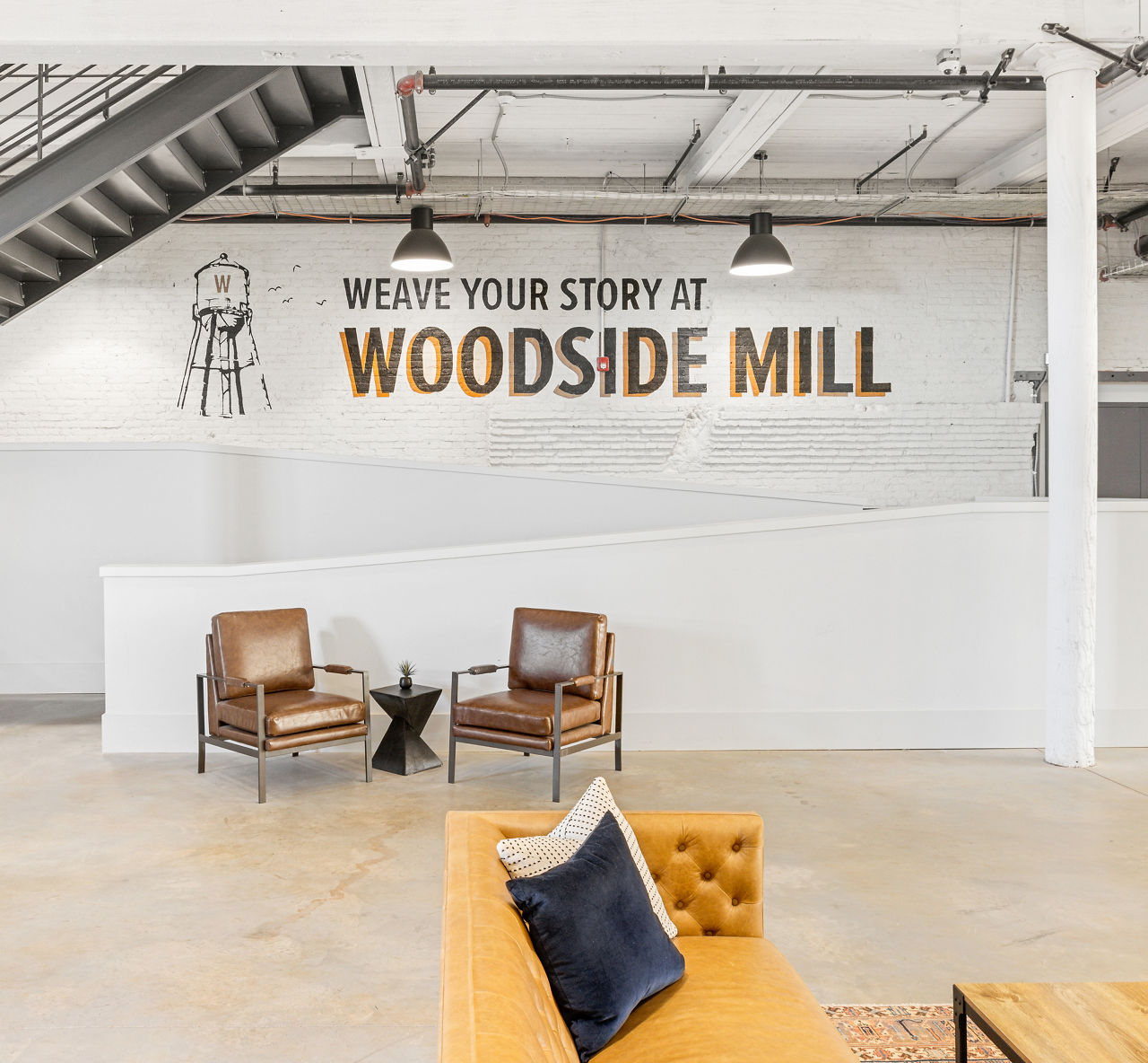 Stylish clubhouse with modern decor at The Lofts at Woodside Mill Apartments, perfect for socializing and events