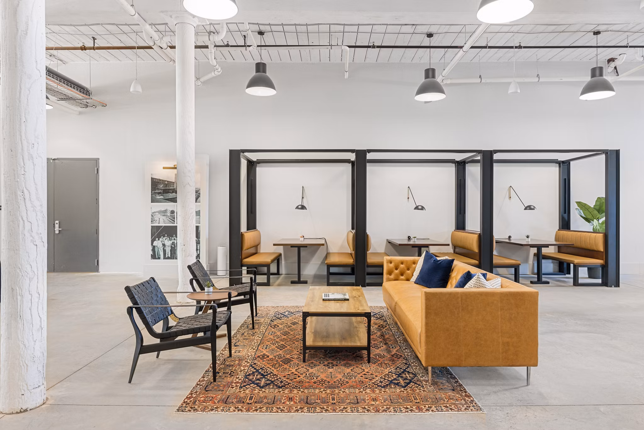 Chic clubhouse at The Lofts at Woodside Mill Apartments with plush seating and modern design