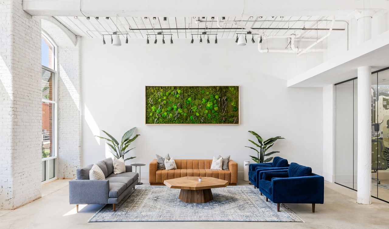 Chic clubhouse with cozy seating at The Lofts at Woodside Mill Apartments, perfect for gatherings and community events
