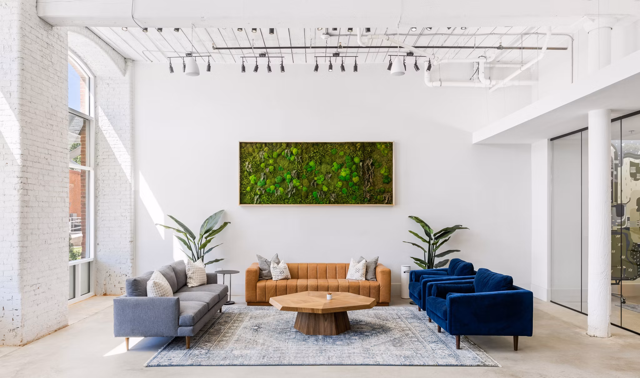 Chic clubhouse with cozy seating at The Lofts at Woodside Mill Apartments, perfect for gatherings and community events