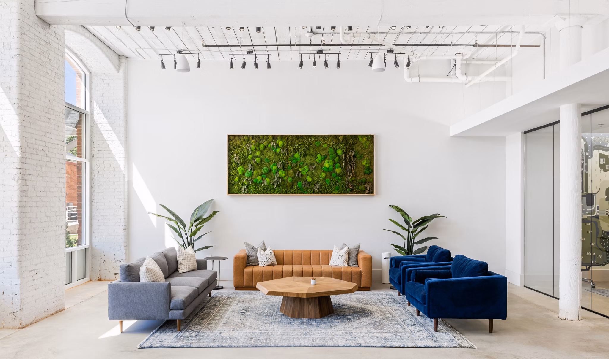 Chic clubhouse with cozy seating at The Lofts at Woodside Mill Apartments, perfect for gatherings and community events