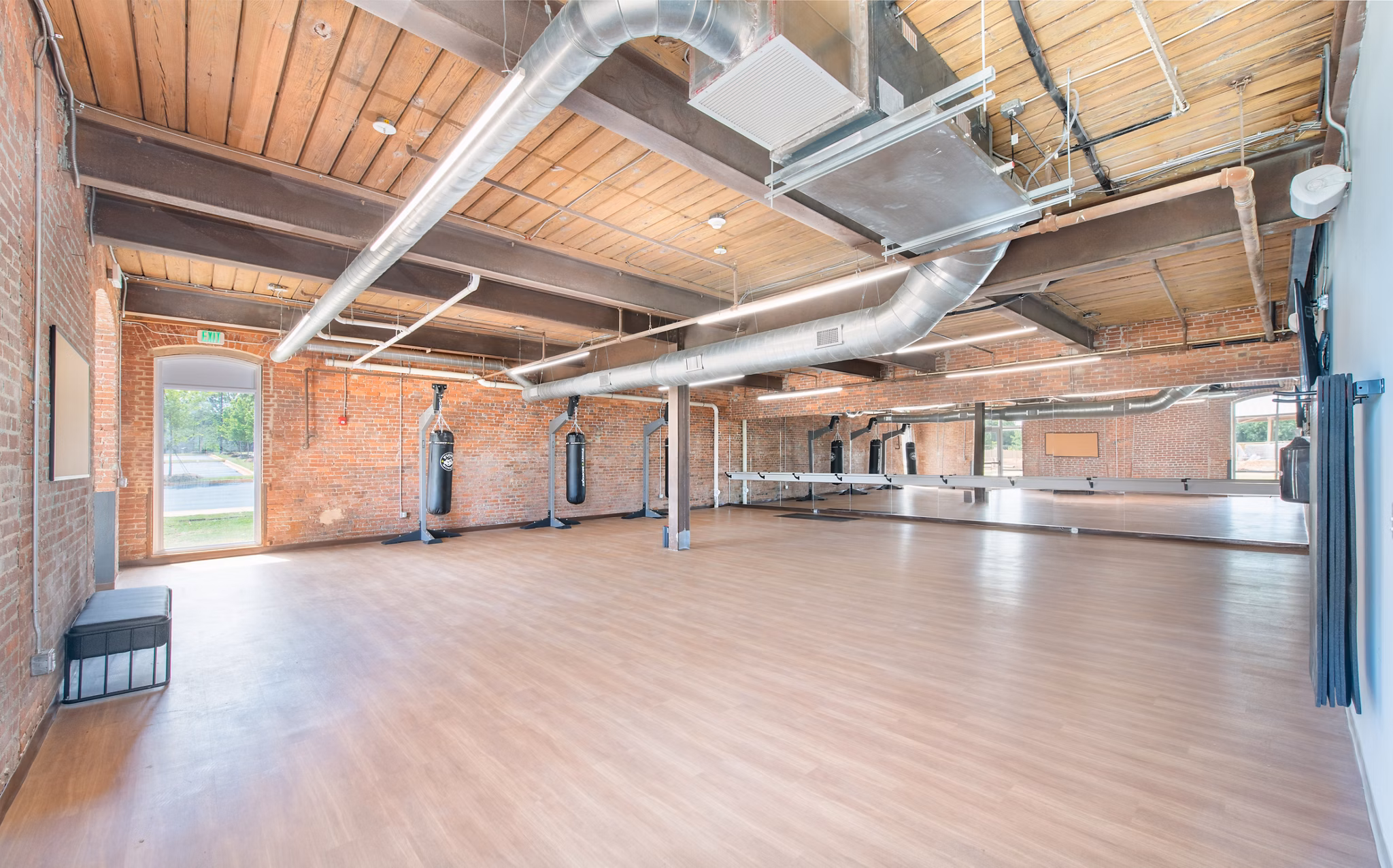 Modern fitness center with state-of-the-art equipment at The Lofts at Woodside Mill Apartments