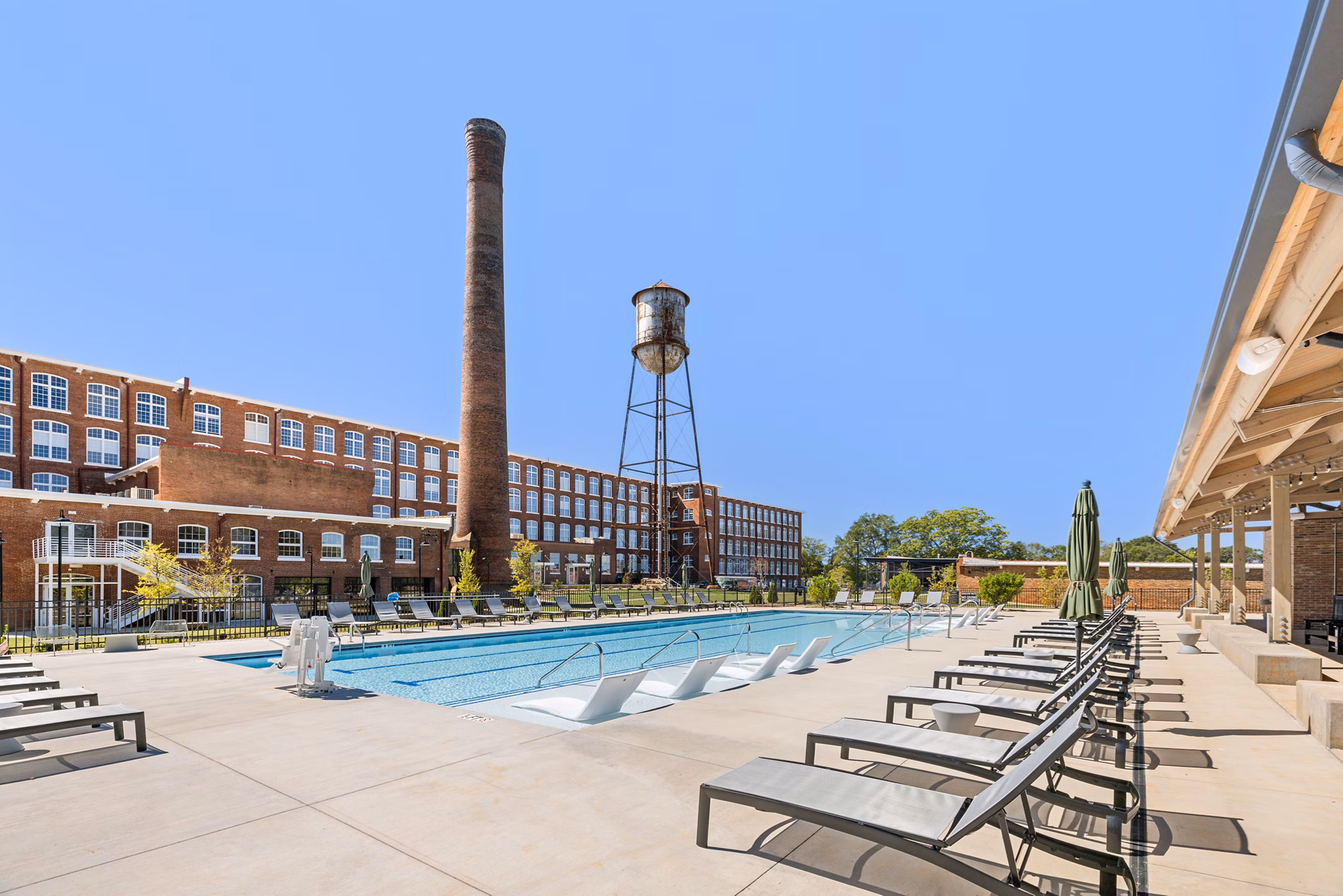 Rooftop pool with city views at The Lofts at Woodside Mill Apartments