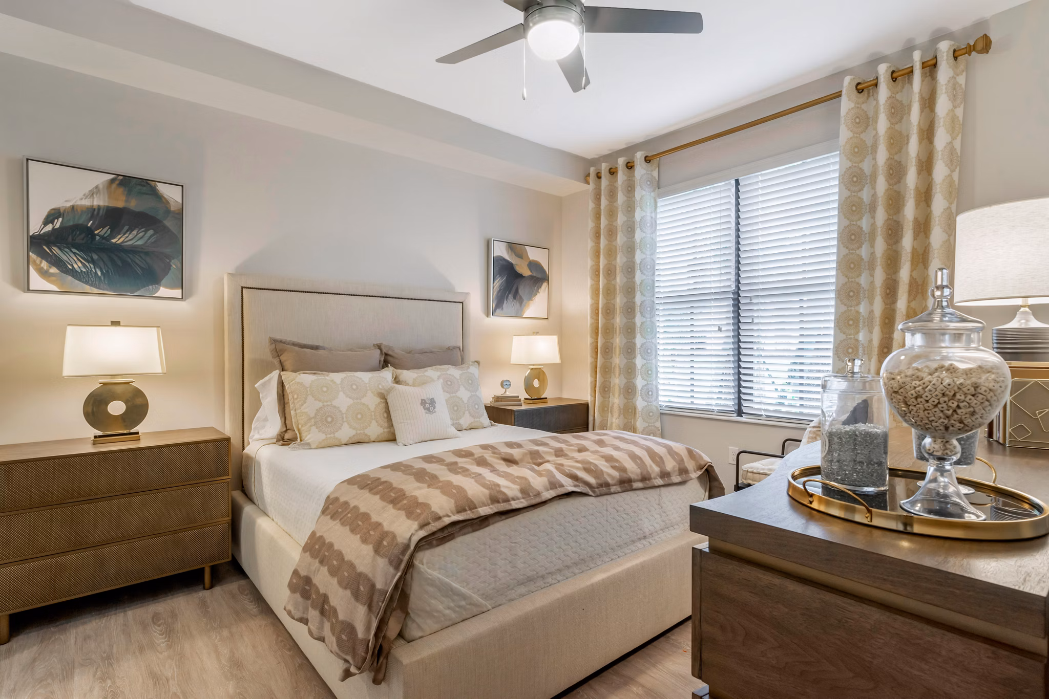 Lago Apartments: Luxurious bedroom with elegant furnishings and large windows, showcasing comfort and style in our premier rental community