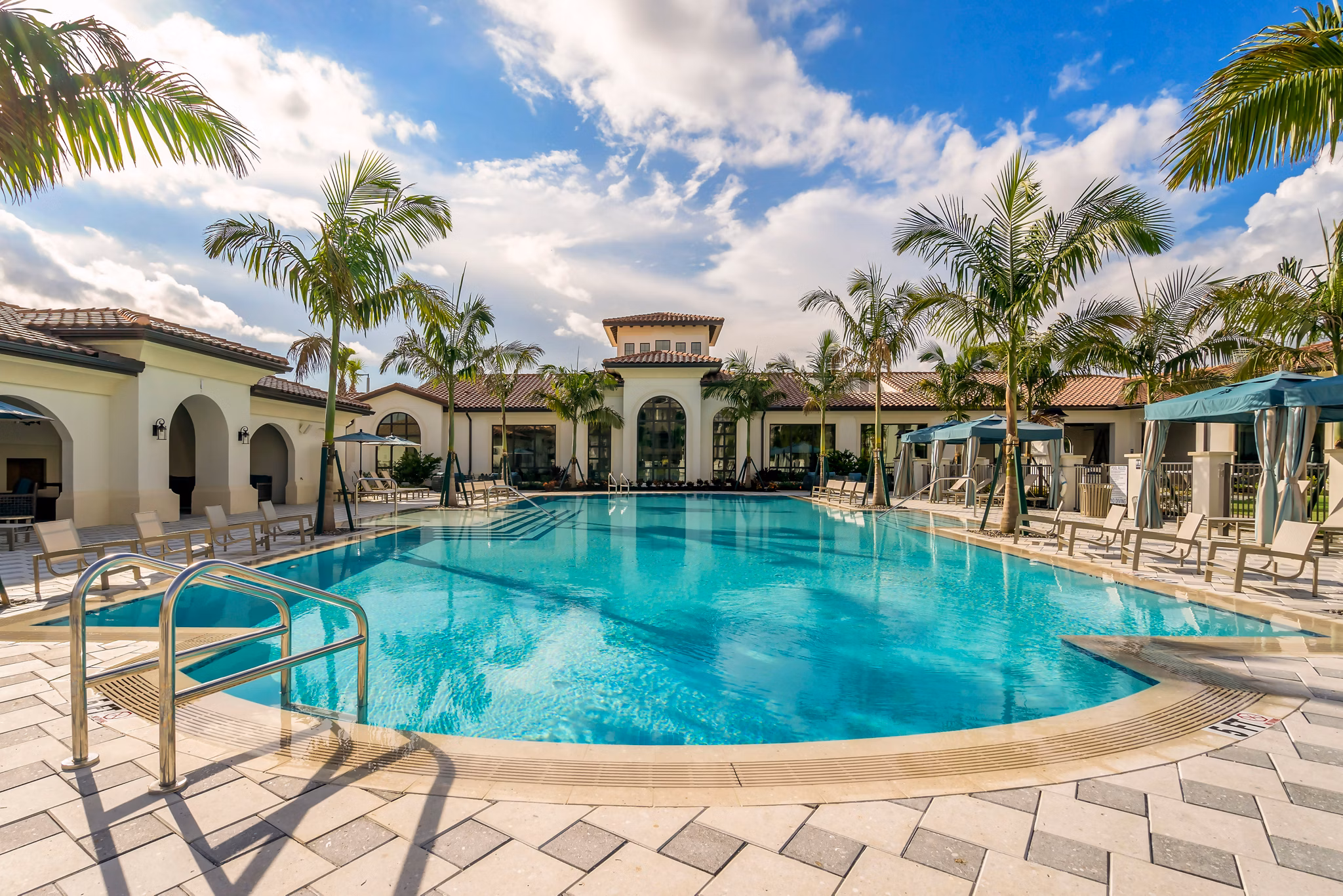 Luxurious pool area at Lago Apartments offering serene views and leisure facilities for relaxation and enjoyment