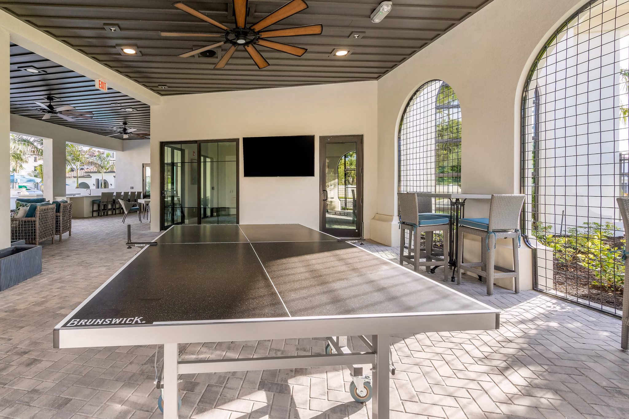 Outdoor sport court with basketball hoops at Lago Apartments, luxury community offering recreational facilities