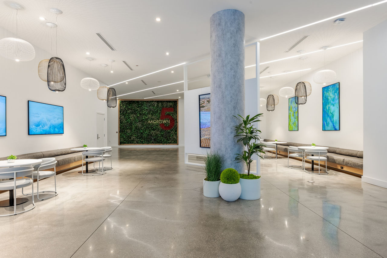 Modern clubhouse with stylish seating at Midtown 5 Apartments in Miami, offering luxury amenities and social spaces for residents