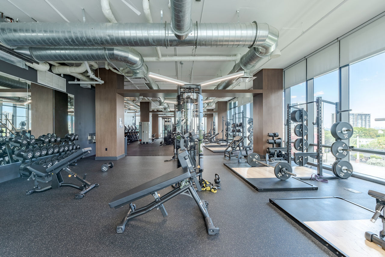 State-of-the-art fitness center with modern equipment at Midtown 5 Apartments, ideal for luxury lifestyle enthusiasts