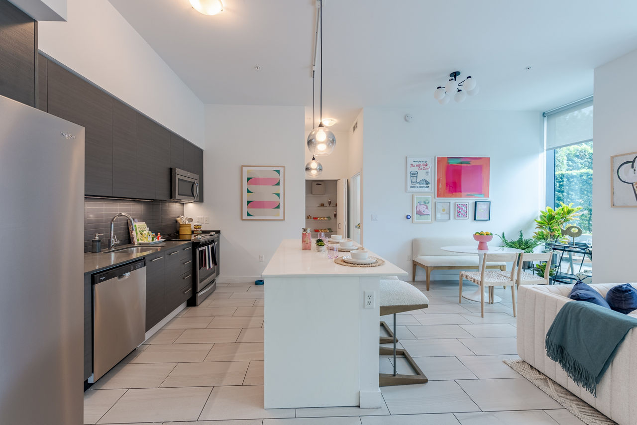Spacious kitchen with modern appliances at Midtown 5 Apartments, featuring sleek cabinetry and a central island for luxury living