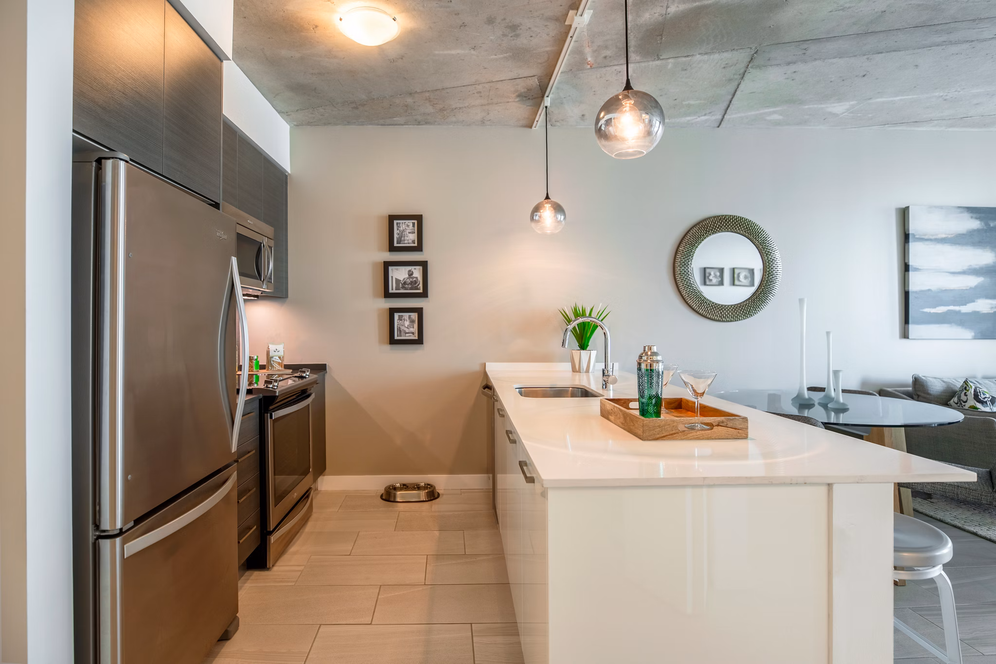 Spacious kitchen with modern appliances at Midtown 5 Apartments, featuring sleek cabinetry and a central island for luxury living