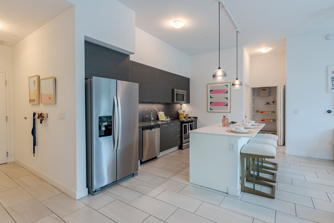 Modern kitchen with stainless steel appliances at Midtown 5 Apartments