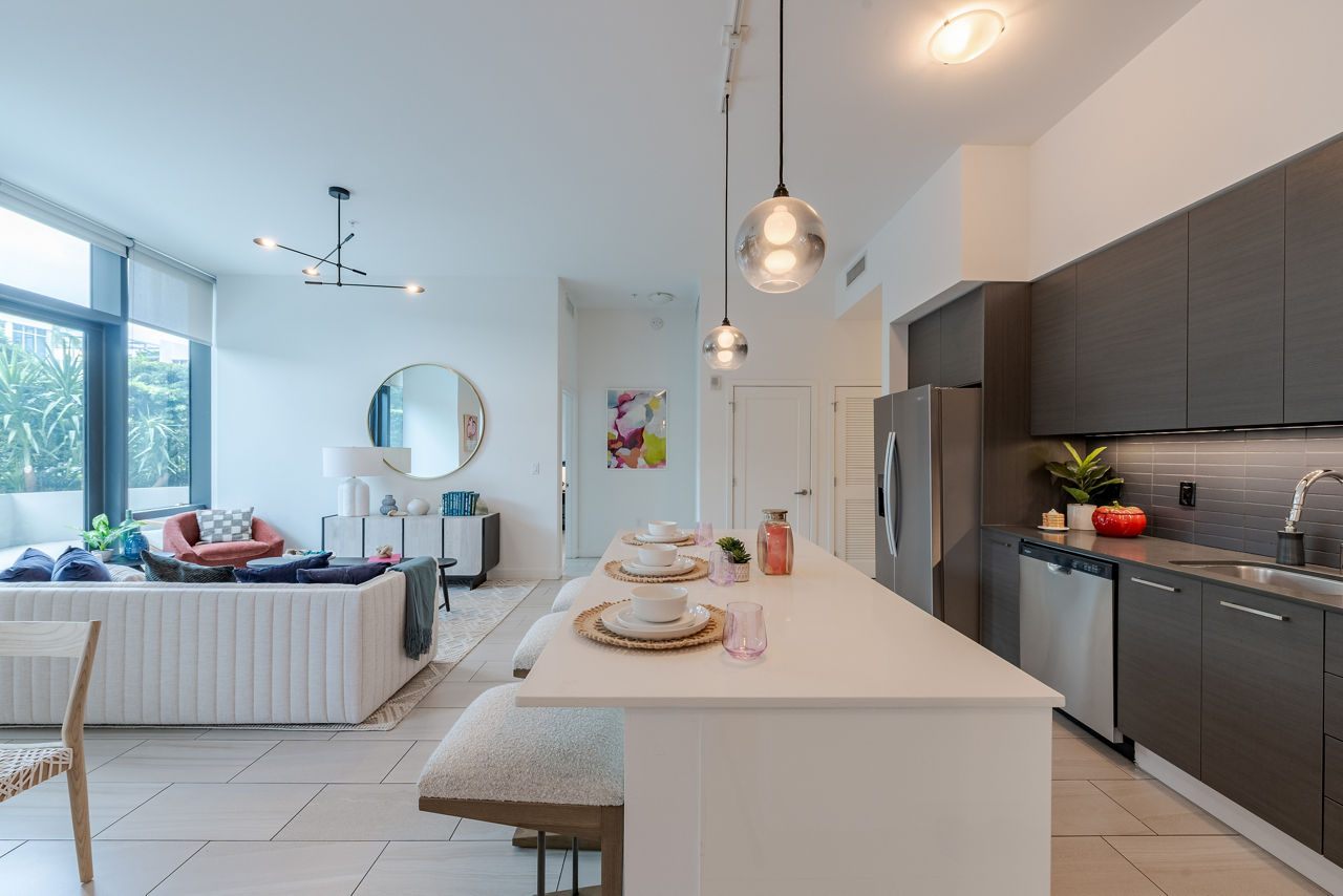 Modern living room with stylish furnishings and large windows at Midtown 5 Apartments, offering luxurious city living