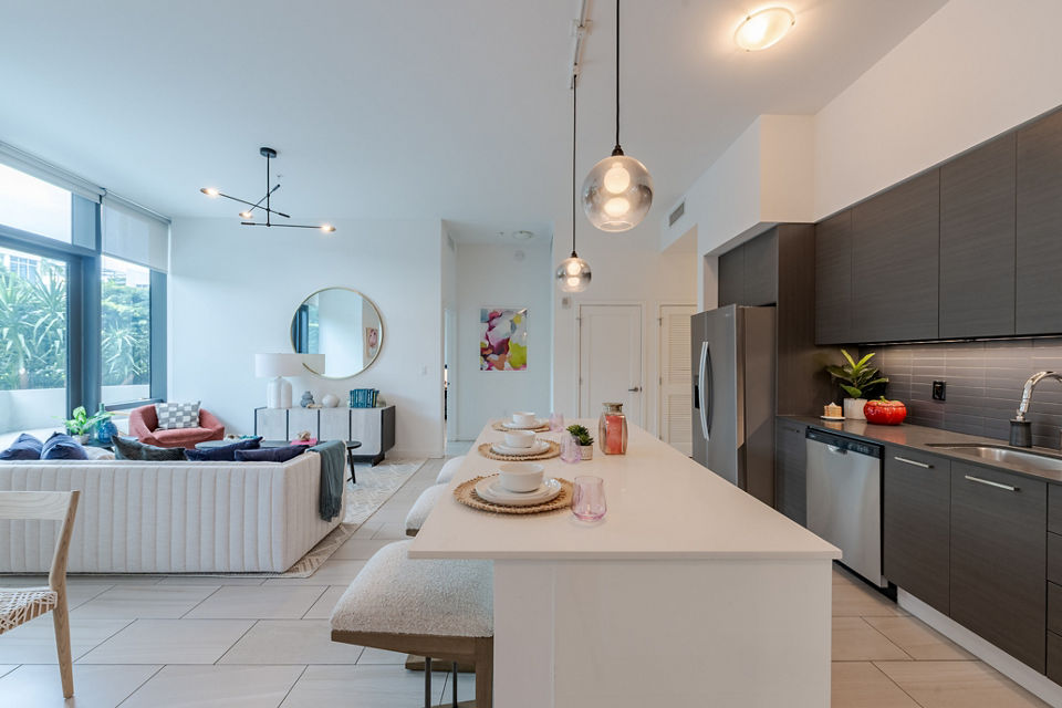 Modern living room with stylish furnishings and large windows at Midtown 5 Apartments, offering luxurious city living
